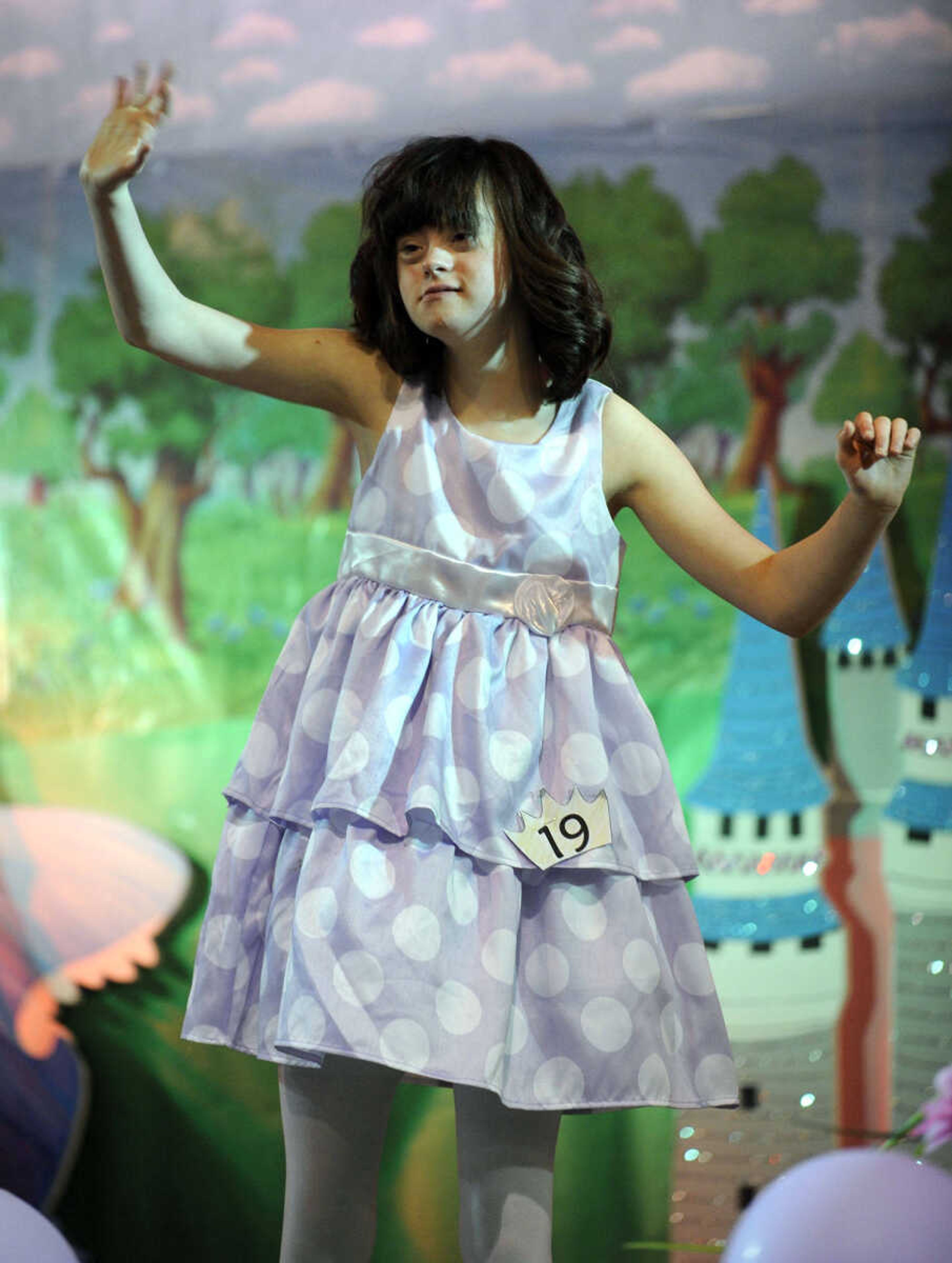 Emma Watson waves to the crowd in the 10-14 age division of the S. E. Missouri Angels Pageant on Saturday, April 26, 2014 at Scott City High School.