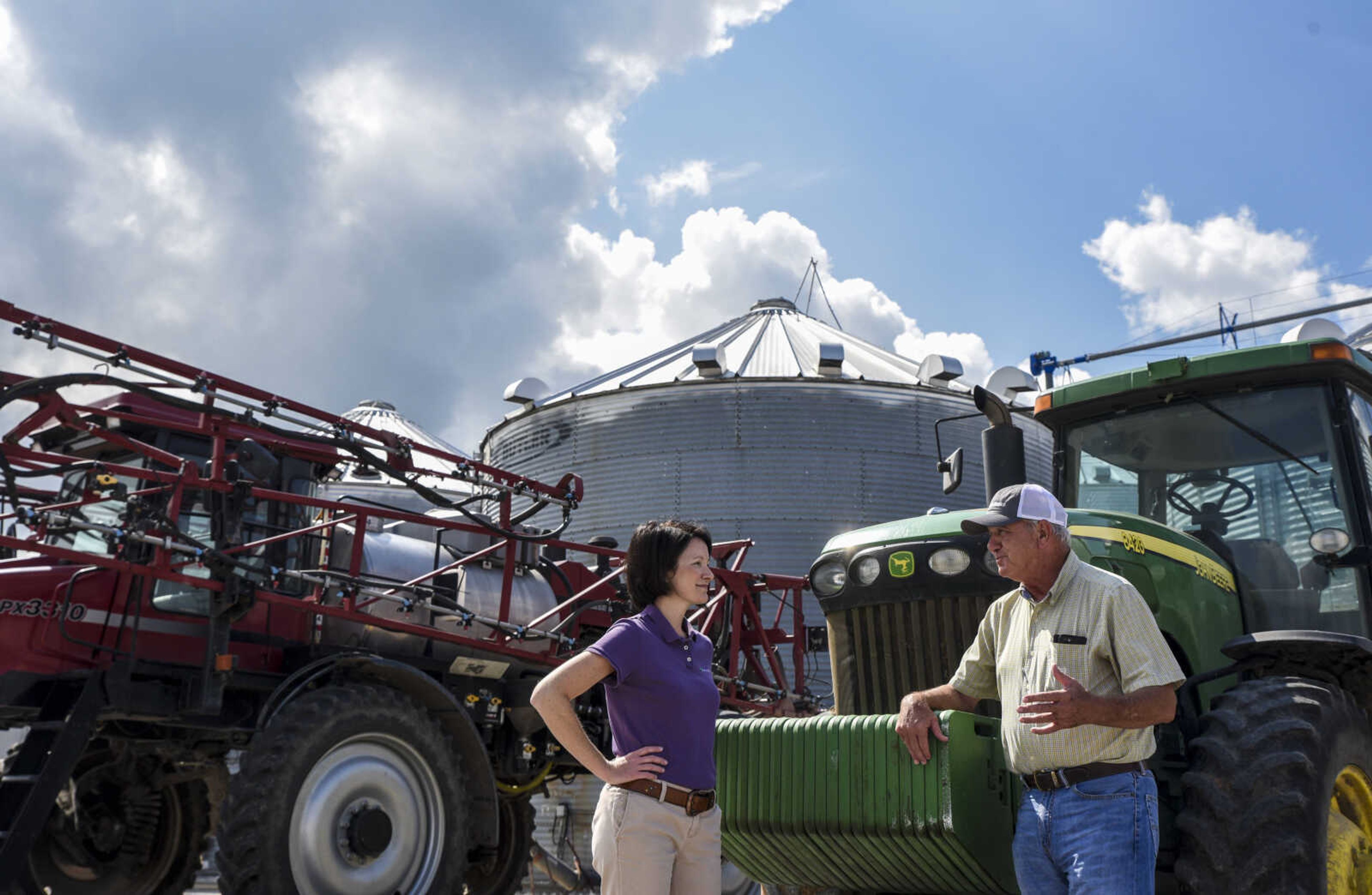 Heather Couch, vice president and branch manager of Farm Credit of Southeast Missouri, talks with her client, Dan Jennings, at his farm in Morehouse, Missouri.