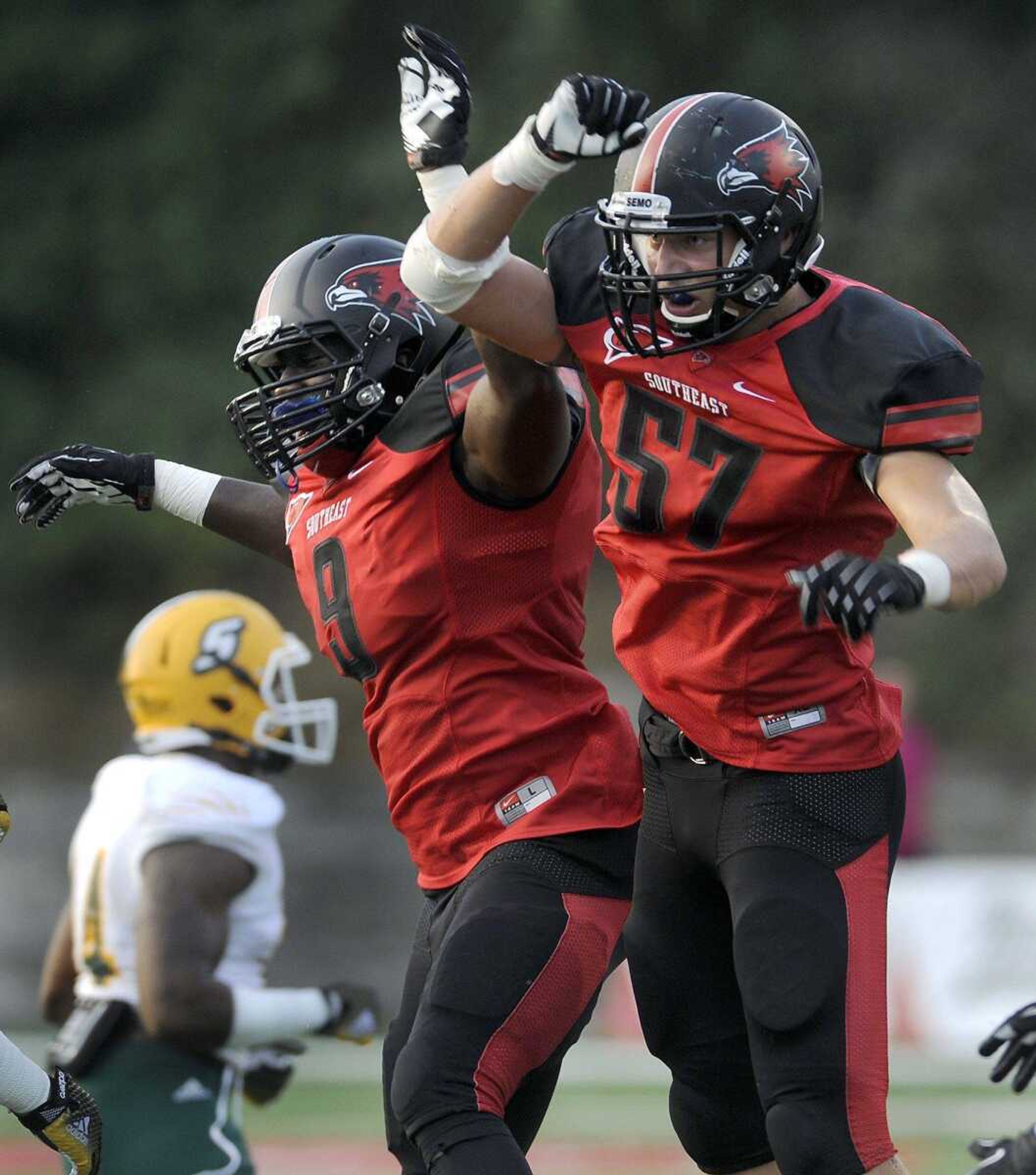 Southeast Missouri State's Chad Meredith, right, celebrates with Terrance Hill after Meredith sacked Southeastern Louisiana quarterback Bryan Bennett for an 11-yard loss during the first quarter Saturday, Sept. 20, 2014 at Houck Stadium. (Fred Lynch)