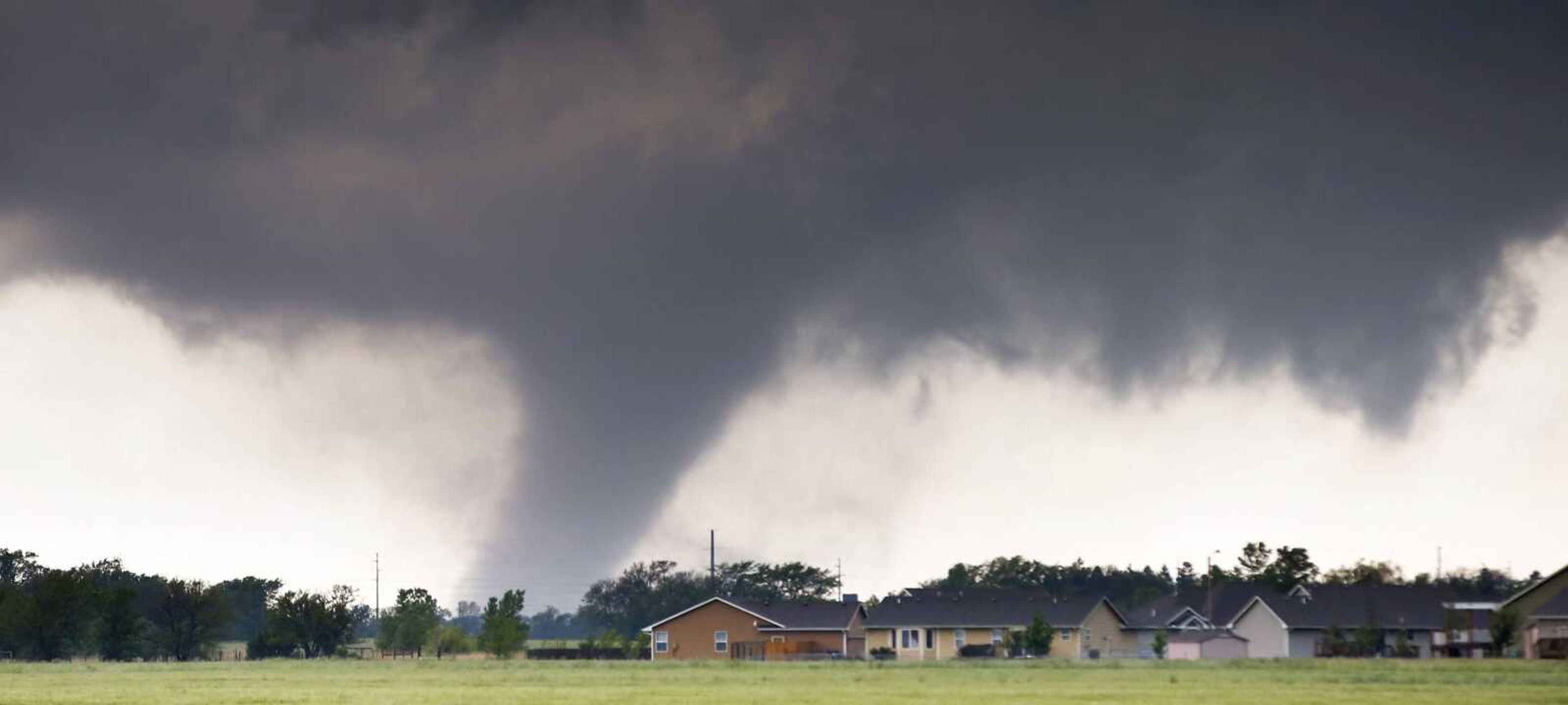 A tornado passes Wednesday near Halstead, Kansas. Tornadoes strafed parts of Texas, Oklahoma, Kansas and Nebraska on Wednesday and early Thursday. (Travis Heying ~ The Wichita Eagle)