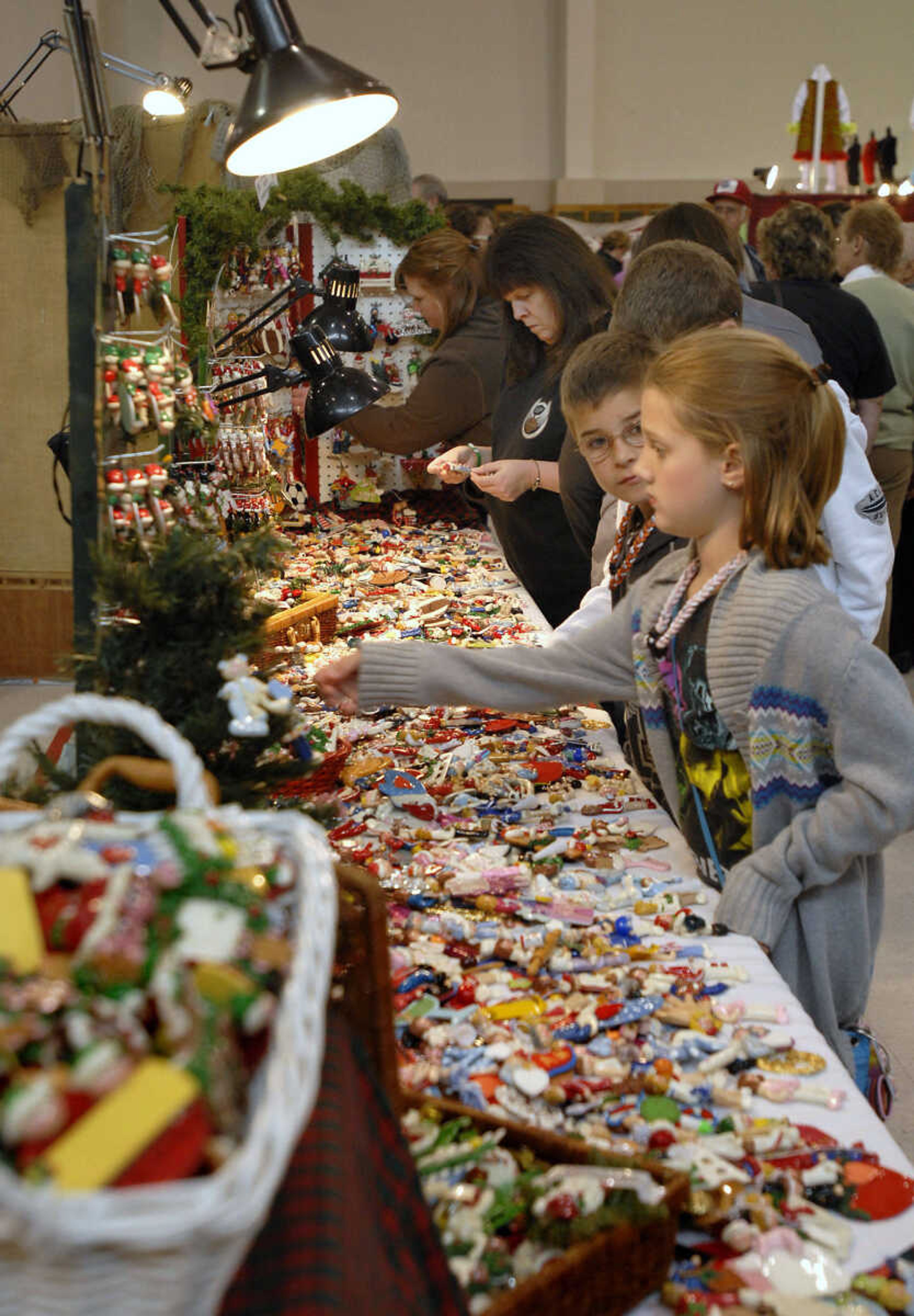 KRISTIN EBERTS ~ keberts@semissourian.com

Shoppers check out the hand-made dough ornaments by Judy McCown during the Arts and Crafts Extravaganza at the Osage Center in Cape Girardeau on Saturday, Nov. 19, 2011.