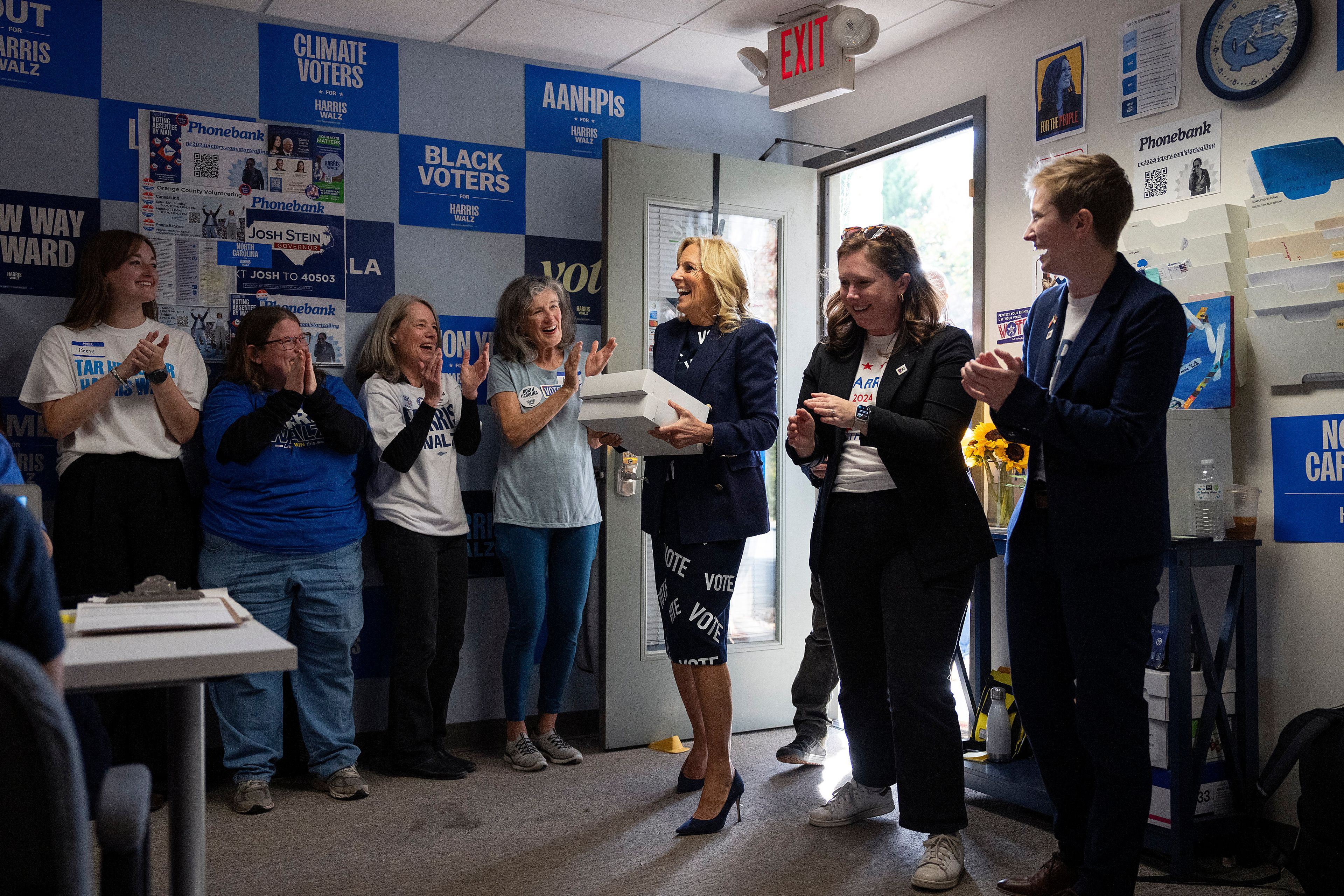 First lady Jill Biden, center, delivers boxes of cookies to supporters at an election event for Democratic presidential nominee Vice President Kamala Harris, Monday, Nov. 4, 2024, in Carrboro, N.C. (AP Photo/Grant Halverson)