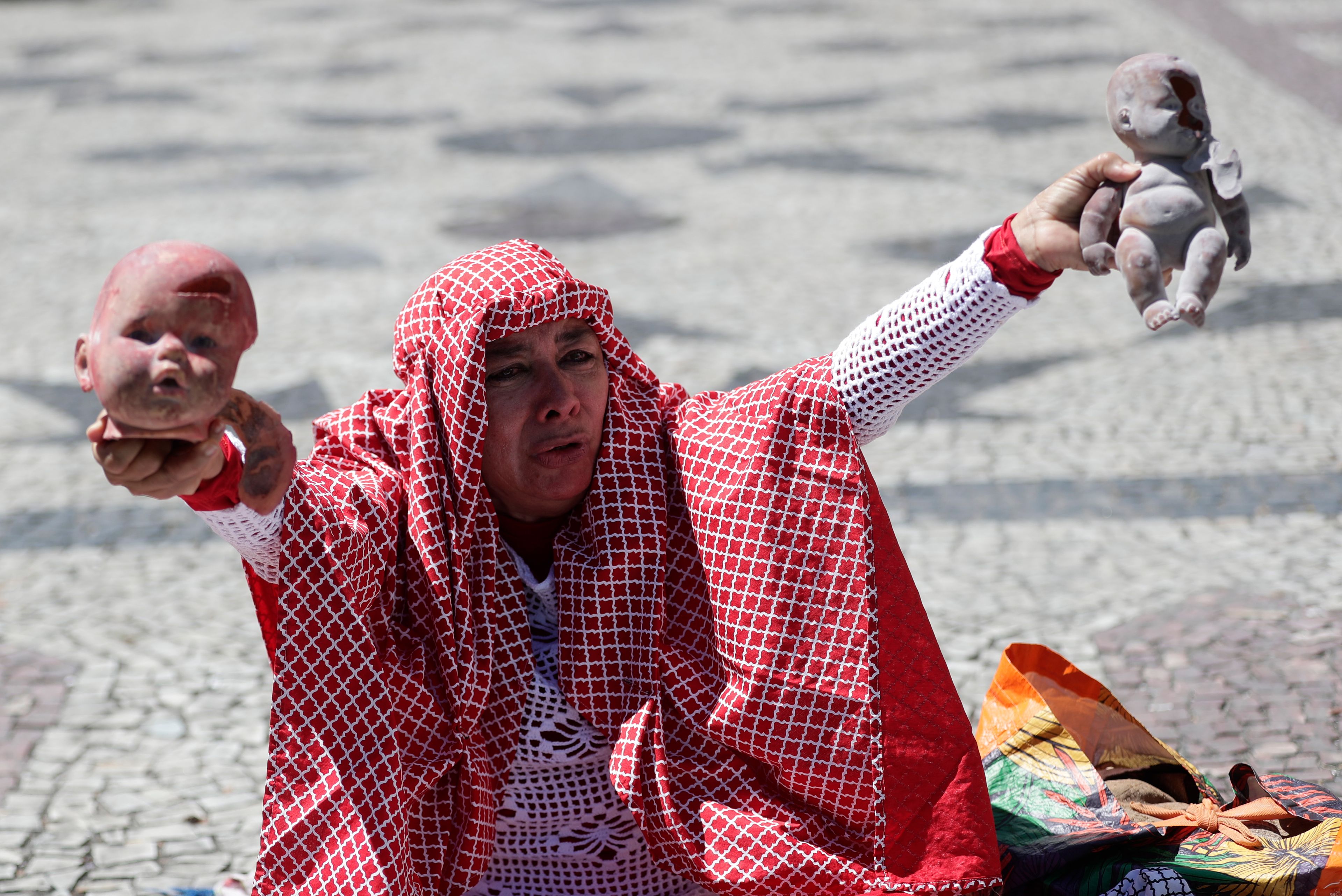 A demonstrator protests to show solidarity with Palestinian people in Rio de Janeiro, Monday, Nov. 18, 2024, as leaders meet for the G20 summit. (AP Photo/Bruna Prado)