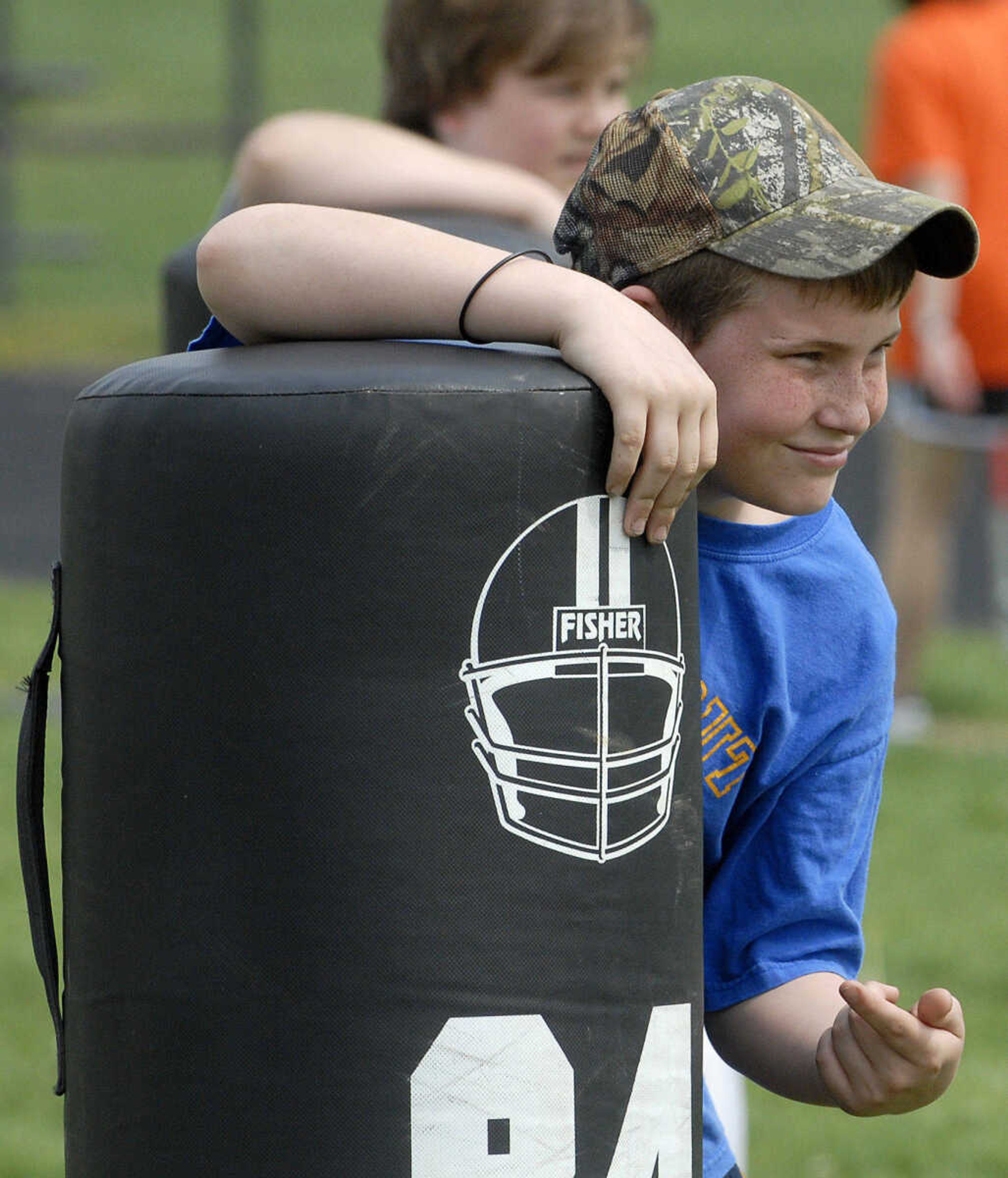 LAURA SIMON~lsimon@semissourian.com
Hunter Parrish dares a cub scout to hit the target during the football toss Sunday, April 10, 2011 during the Cub Scout track and field day at Cape Central Junior High in Cape Girardeau.