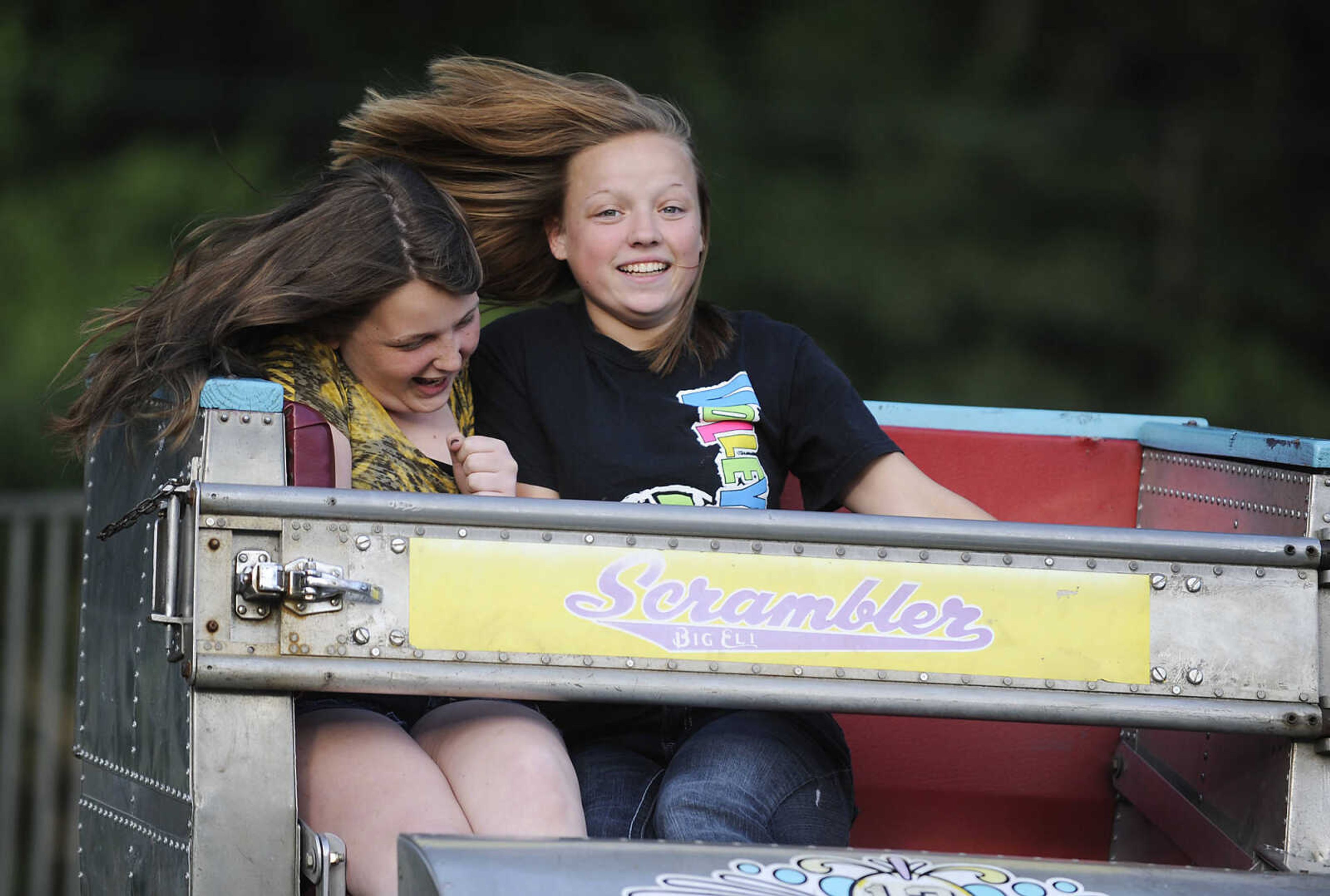 Hannah Moore, 14, left, and Nakia Parris, 14, ride the Scrambler at the 36th annual Scott City Summerfest Friday, June 1, at Scott City Park.