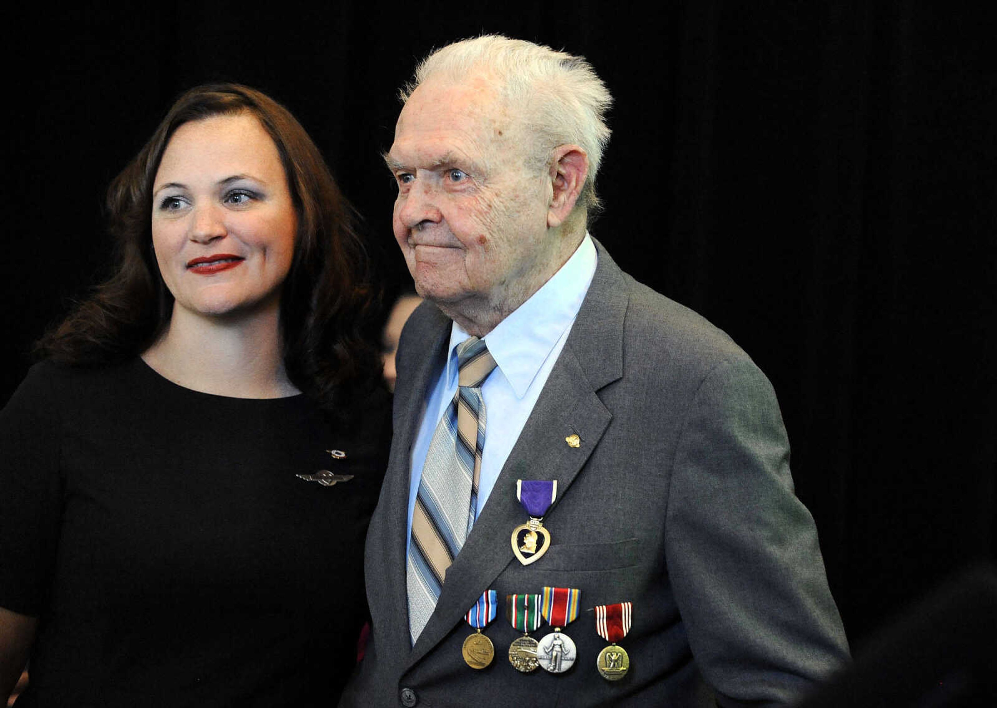 LAURA SIMON ~ lsimon@semissourian.com

Sgt. Clifford Heinrich, right, poses for a photo with Michelle Chastain Oden on Monday, March 21, 2016, during the living history event honoring the WWII lost crew of the Flying Fortress 812, and the medal presentation to Sgt. Clifford Heinrich at Alma Schrader Elementary. Chastain Oden is the great-niece of Lt. Walter B. Graves, the co-pilot on the Flying Fortress 812. Heinrich was presented with an American Campaign Medal, WWII Victory Medal, Army Good Conduct Medal, a WWII Lapel Button, European-African-Middle Eastern Campaign Medal and the Purple Heart for his service during WWII during Monday's presentation.