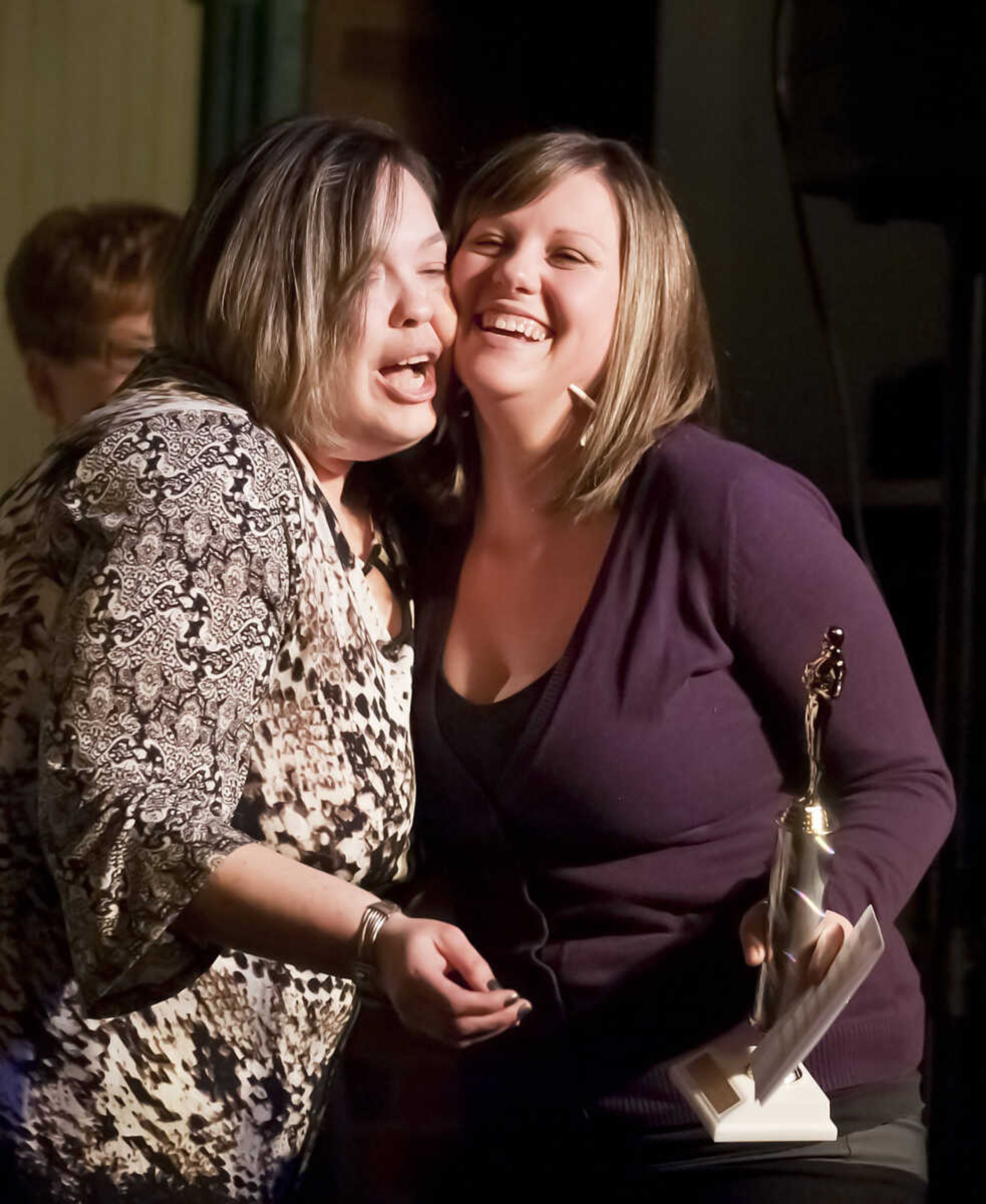 Andrea Schovan, left, presents Katrina Toeniskoetter with her husband Michael's Abbott Award for best supporting actor for her husband, Micheal, during the Abbott Awards, the River City Players' annual awards ceremony, Saturday, Jan. 18, at Port Cape in downtown Cape Girardeau. Auditions for the first production of the 2014 season, "Quiet on the Set," will be held at 7 p.m. Jan. 29 and 30 at Port Cape.