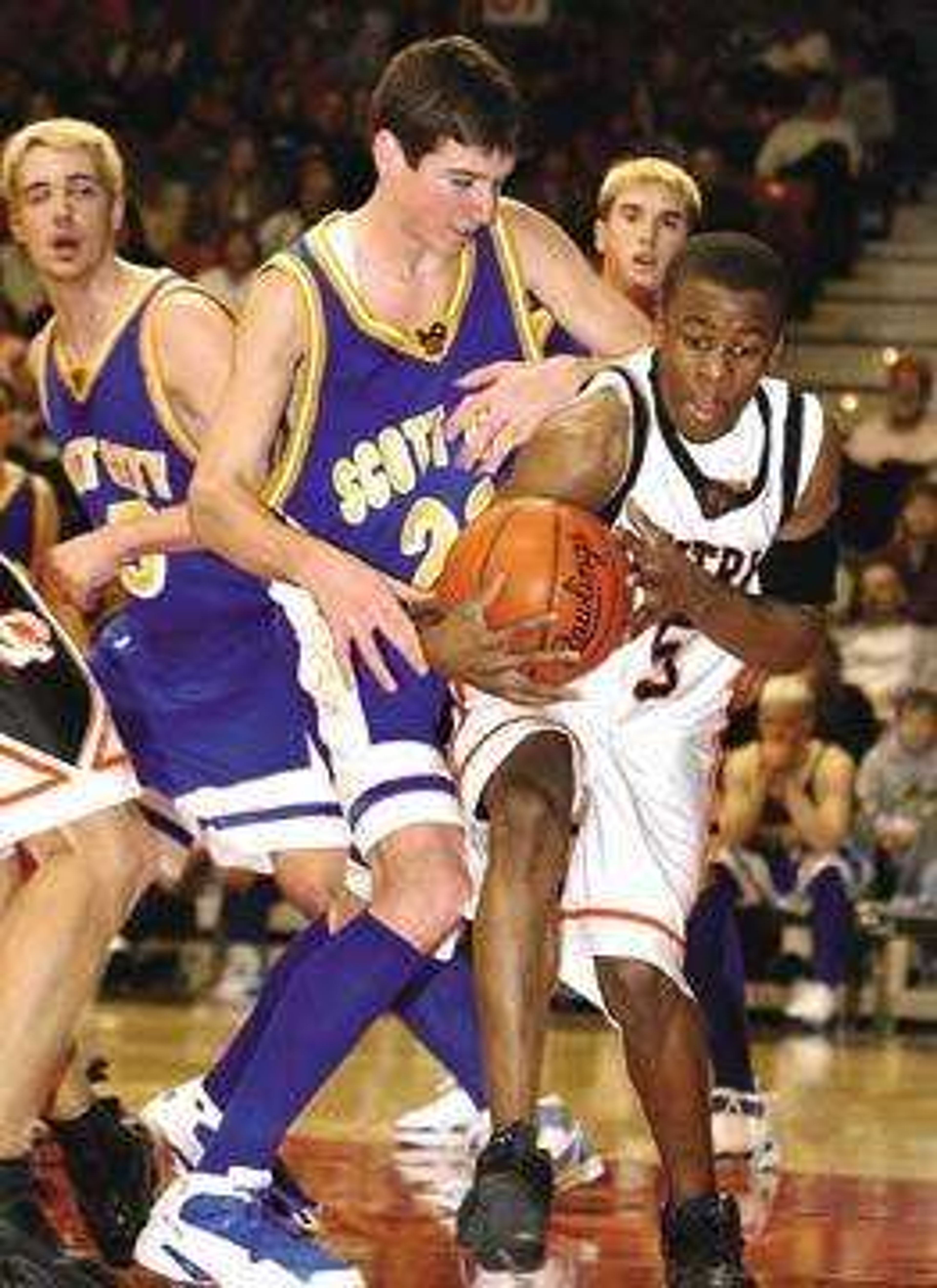 Central's Will Johnson struggled with Scott City's Mark Dannenmueller to maintain control of a rebound during the first period of Monday's semifinal game.