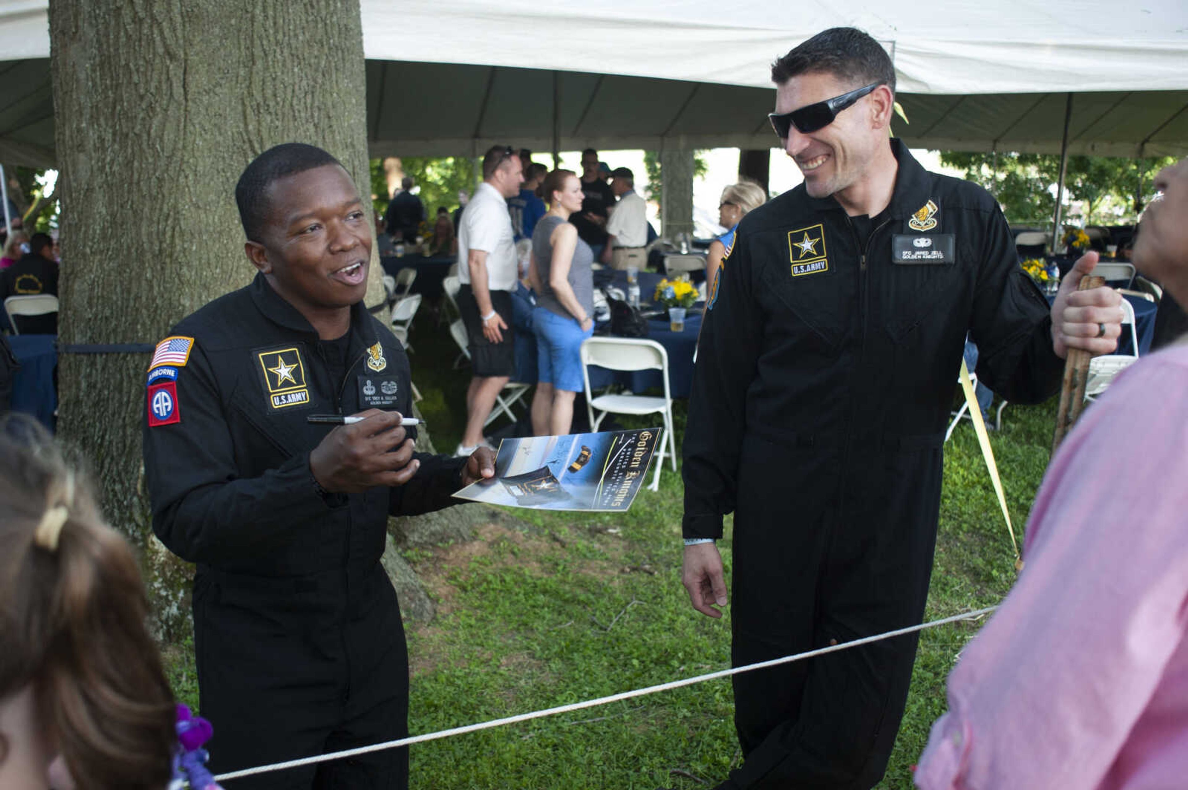 Sgt. 1st Class Trey Gullick, left, and Sgt. 1st Class Jared Zell, with the Golden Knights, meet with the public during the season's first Tunes at Twilight on Friday, May 17, 2019, at Ivers Square near Common Pleas Courthouse in Cape Girardeau.