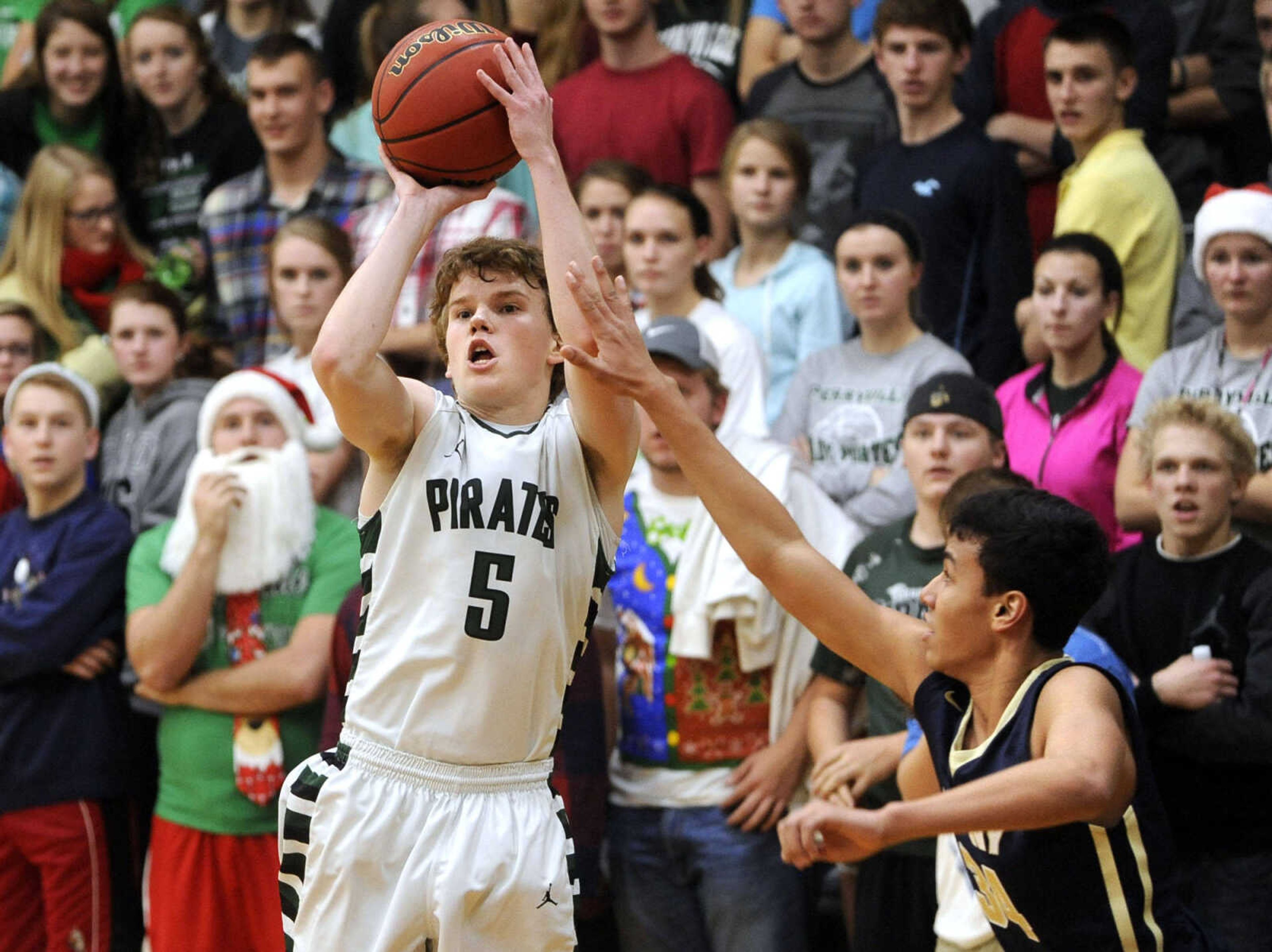 Perryville's McGwire Bartley takes a shot as Saxony Lutheran's Jalen Williams defends during the third quarter Friday, Dec. 18, 2015 in Perryville, Missouri. (Fred Lynch)