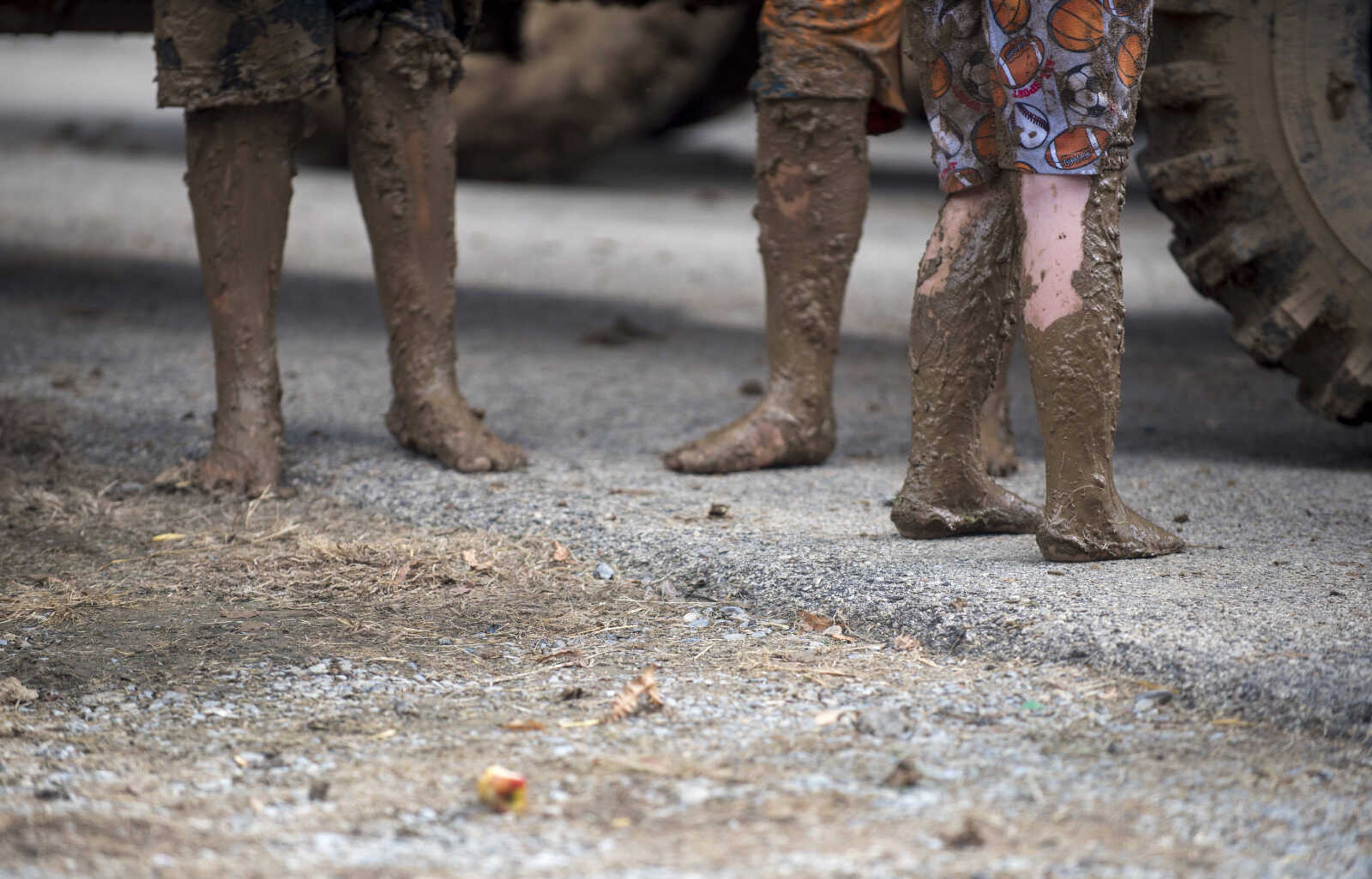 Contestants' muddy feet are seen during Benton Neighbor Days Saturday, September 1, 2018.