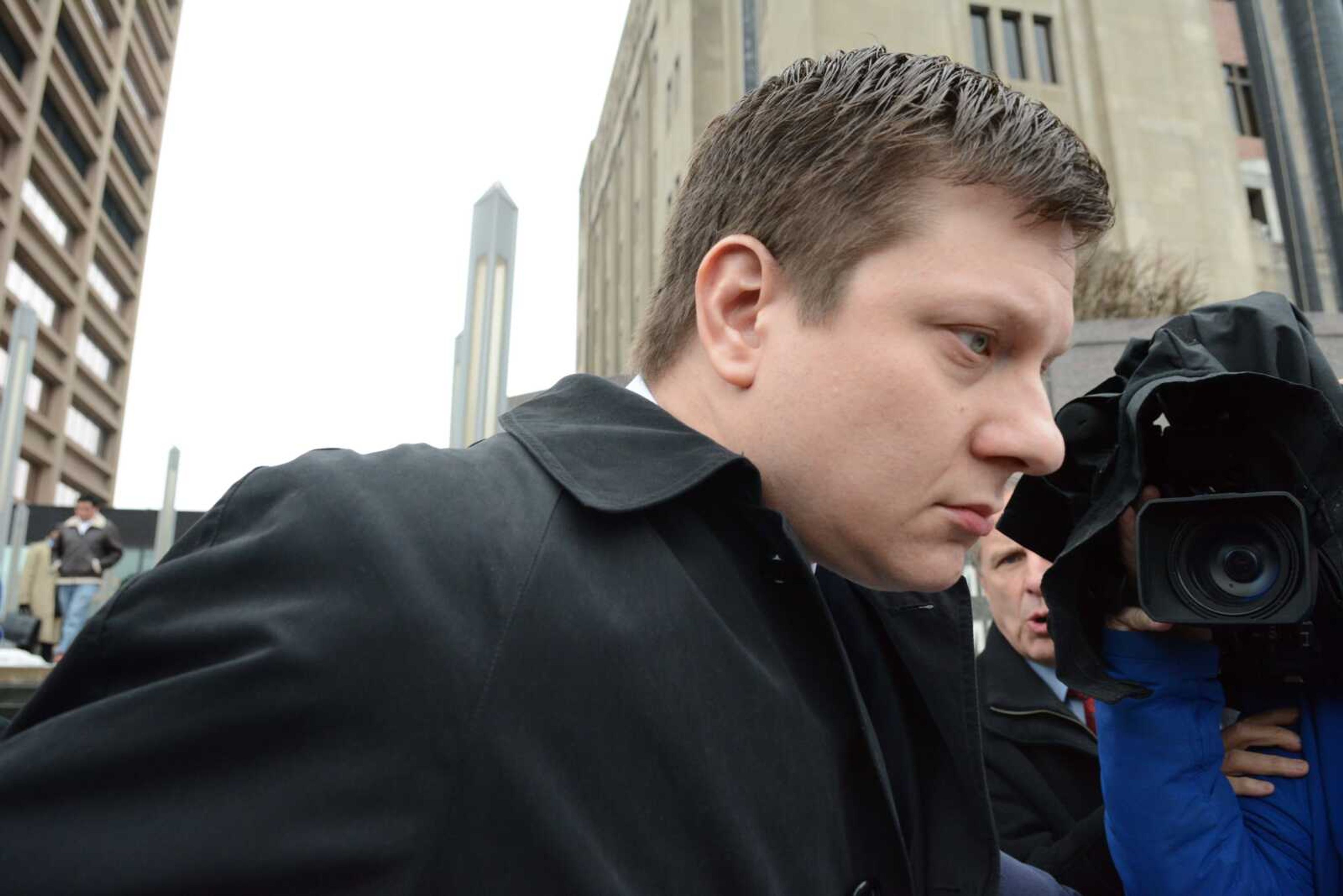 Chicago police officer Jason Van Dyke leaves the Criminal Courts Building on Tuesday in Chicago. (Chicago Sun-Times via AP)