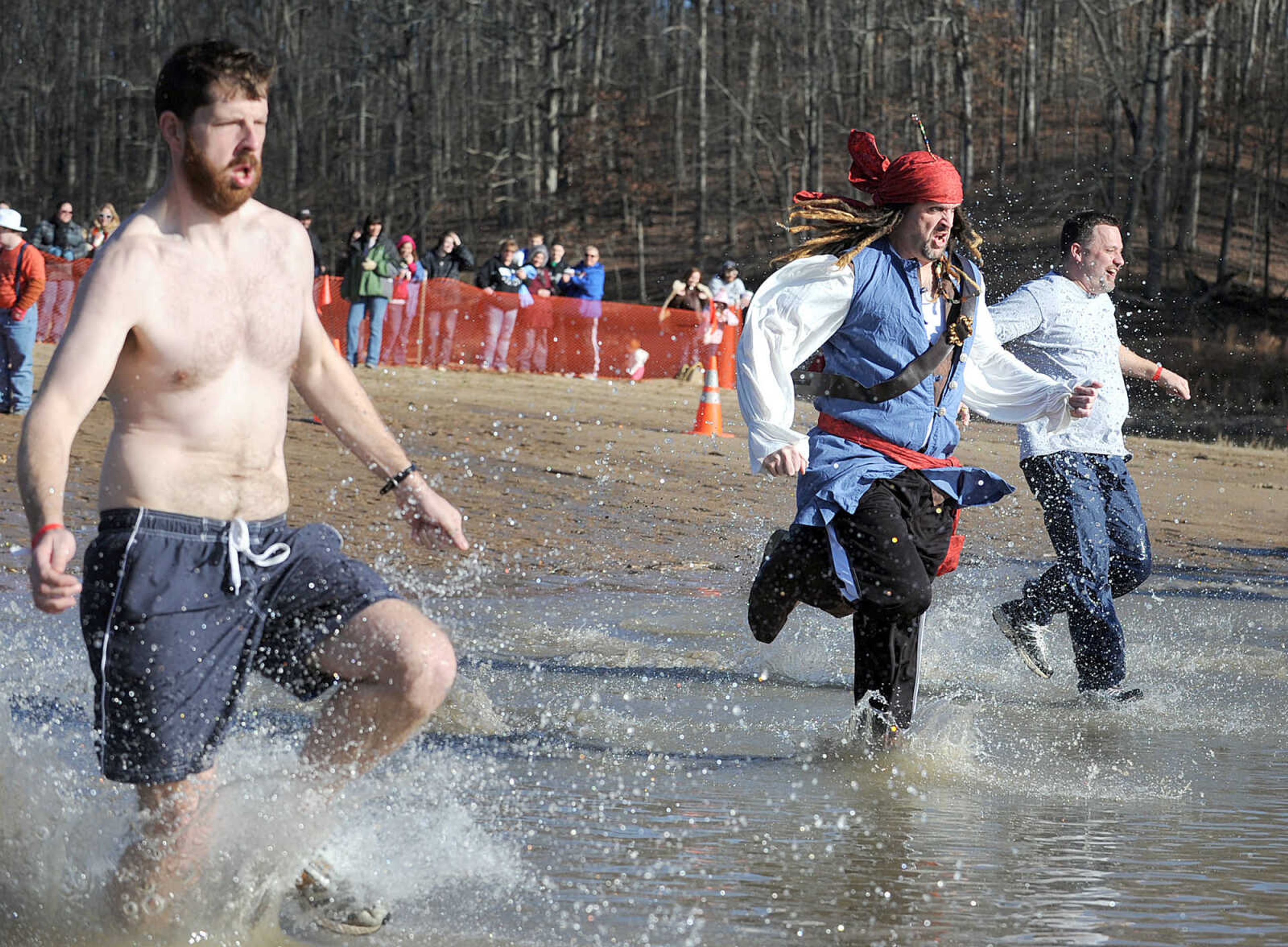 LAURA SIMON ~ lsimon@semissourian.com
People plunge into the cold waters of Lake Boutin Saturday afternoon, Feb. 2, 2013 during the Polar Plunge at Trail of Tears State Park. Thirty-six teams totaling 291 people took the annual plunge that benefits Special Olympics Missouri.