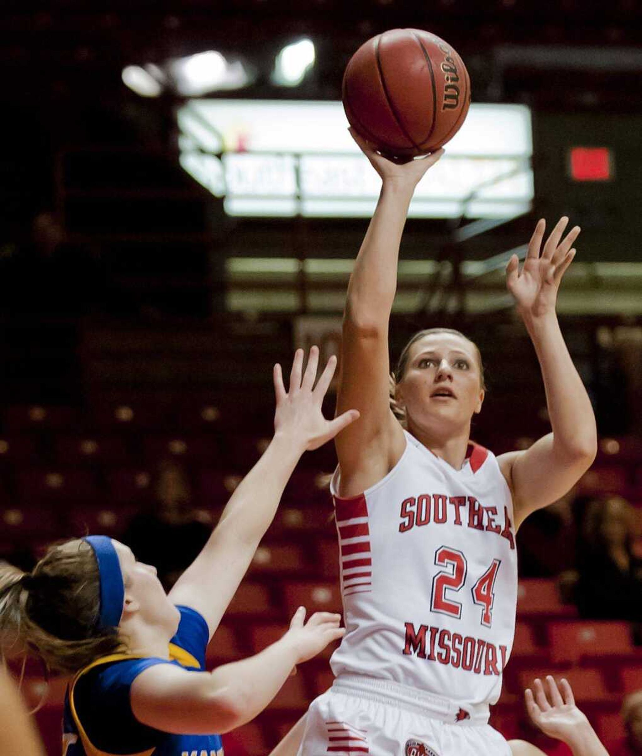 Southeast Missouri State guard Olivia Hackmann takes a shot over Missouri-Kansas City guard Eilise O&#8217;Connor during the second half Thursday at the Show Me Center. The Redhawks won 76-74. (Adam Vogler)