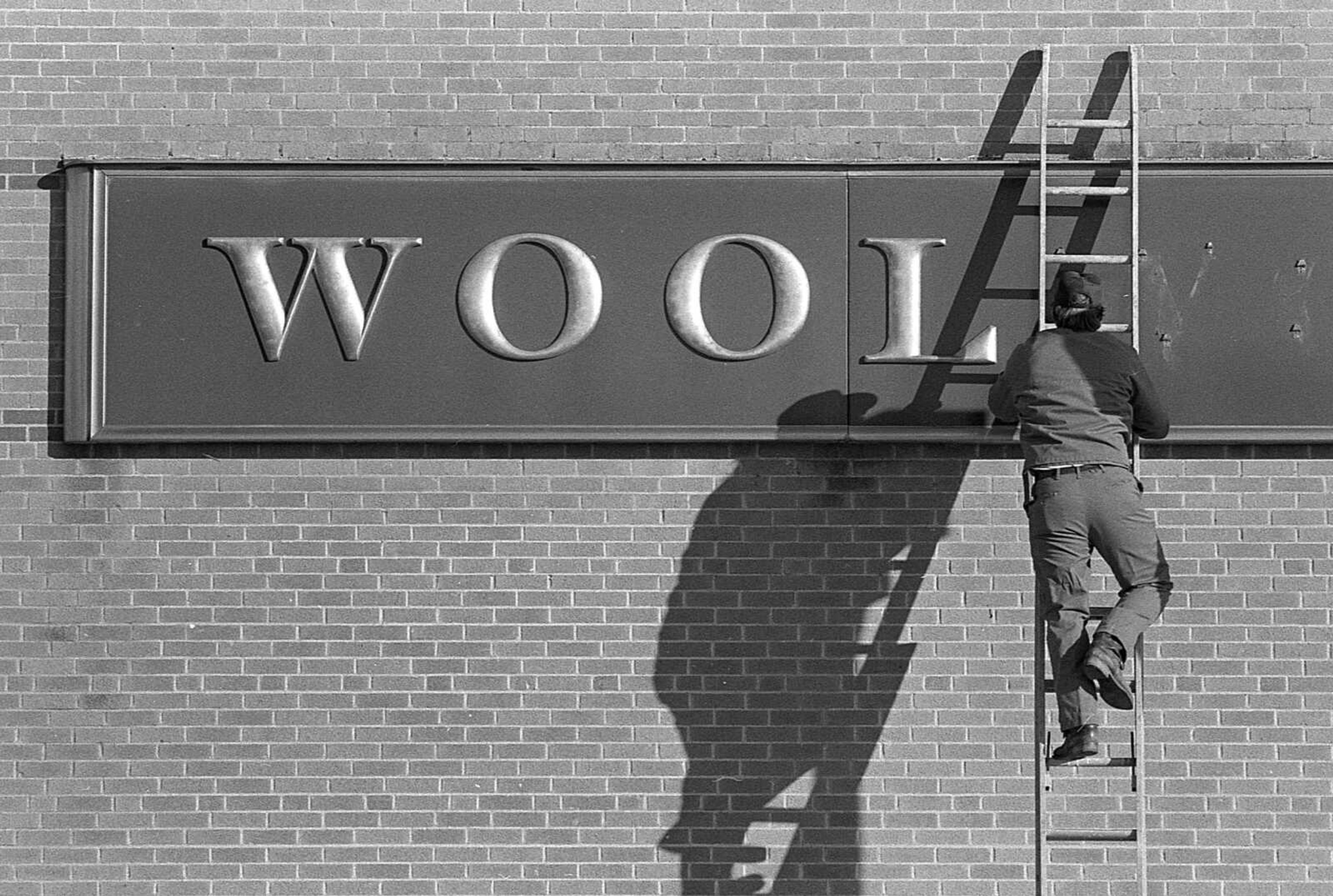 Published Jan. 9, 1978.
Wool sweaters and clothes were in order here today as an arctic cold front sent the thermometer to five degrees. The sign above being dismantled at the now-closed Woolworth's store downtown seems to make the point. (Fred Lynch ~ Southeast Missourian archive)