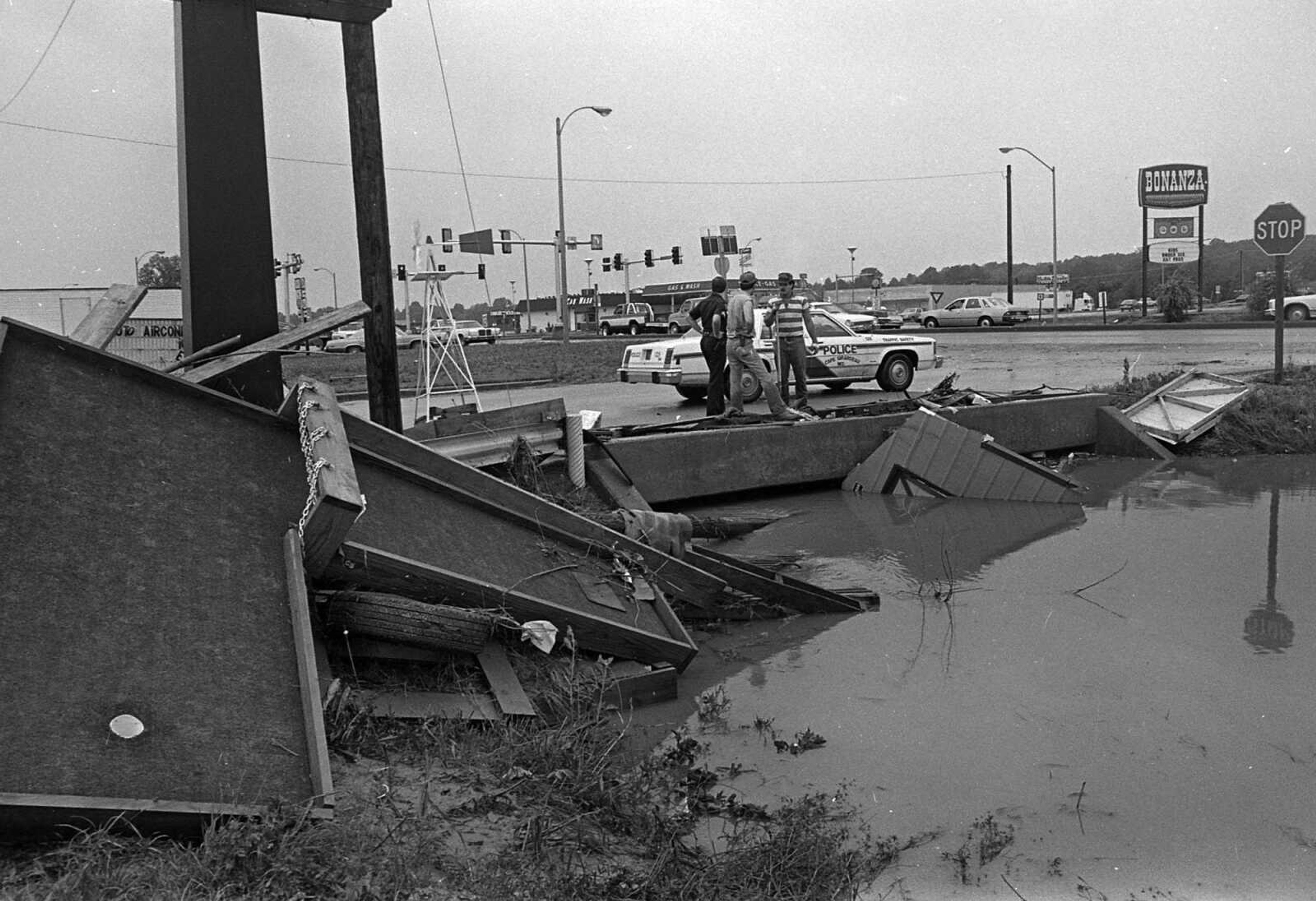 Debris from a miniature golf course came to rest near Kingshighway and William Street after flash flooding May 15, 1986 in the Town Plaza area. (Southeast Missourian)