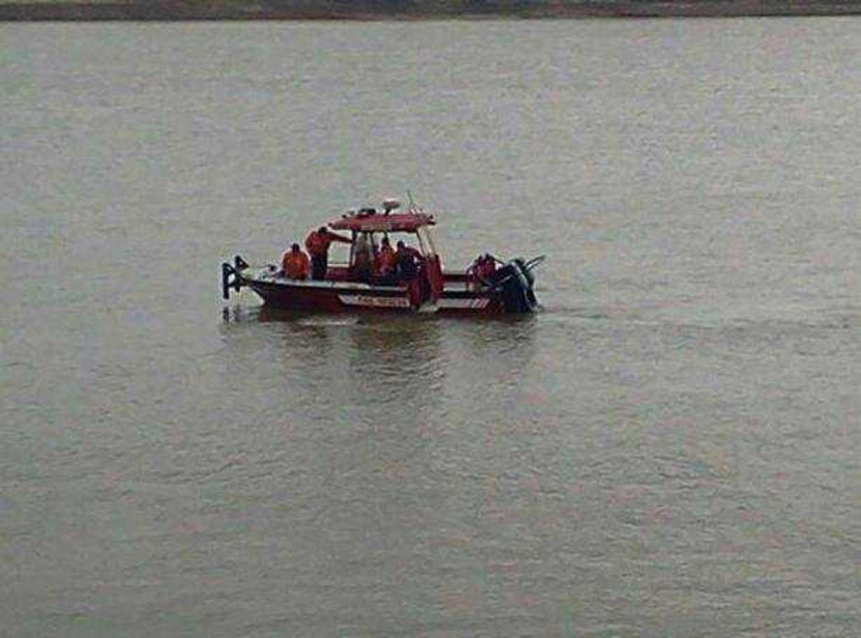 The Cape Girardeau Fire Department responds Friday to a car submerged in the Mississippi River.