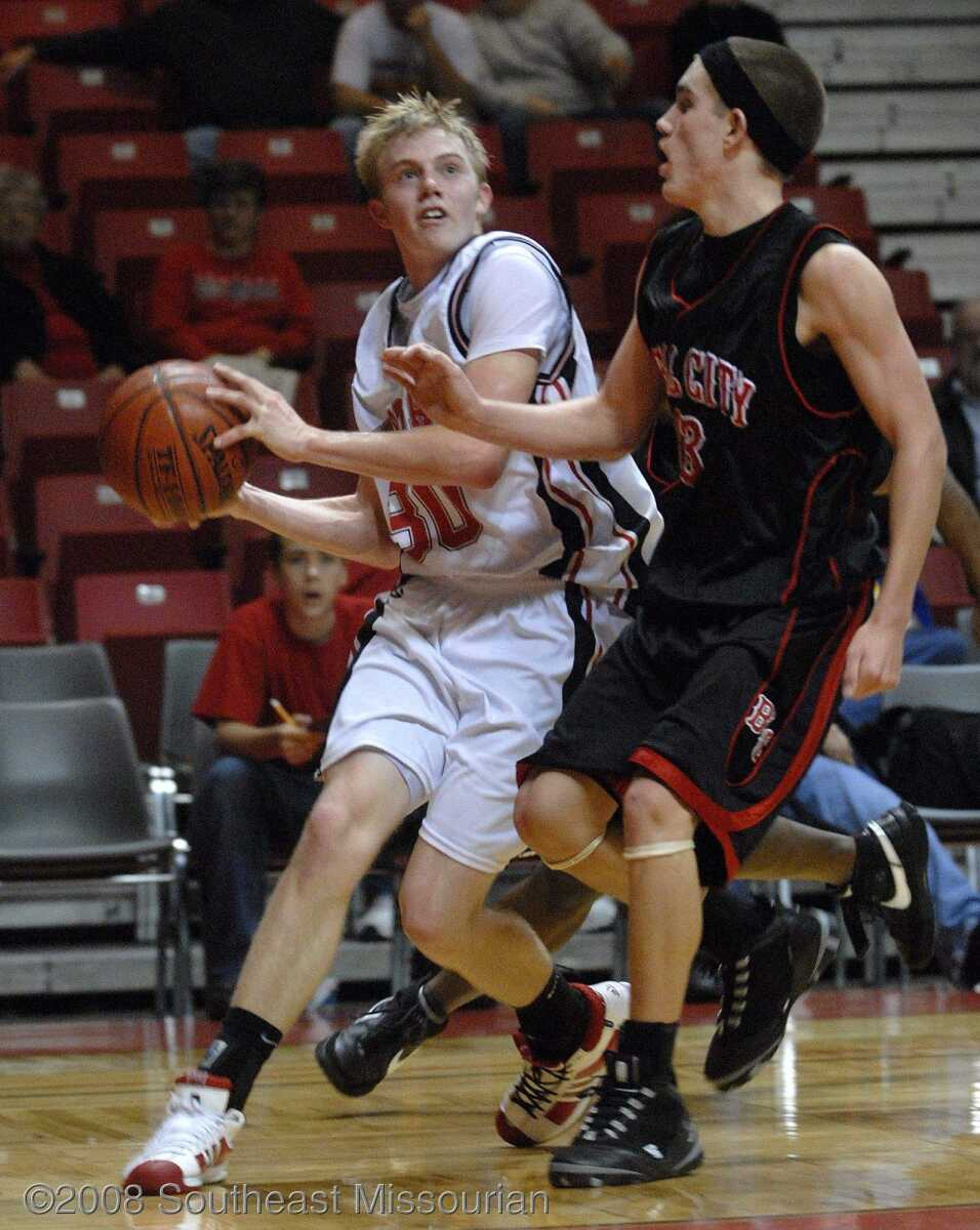 FRED LYNCH ~ flynch@semissourian.com
Woodland's Kyle Reynolds prepares to shoot against Bell City's Jeff Long during the fourth quarter in Southeast Missourian Christmas Tournament Saturday at the Show Me Center.