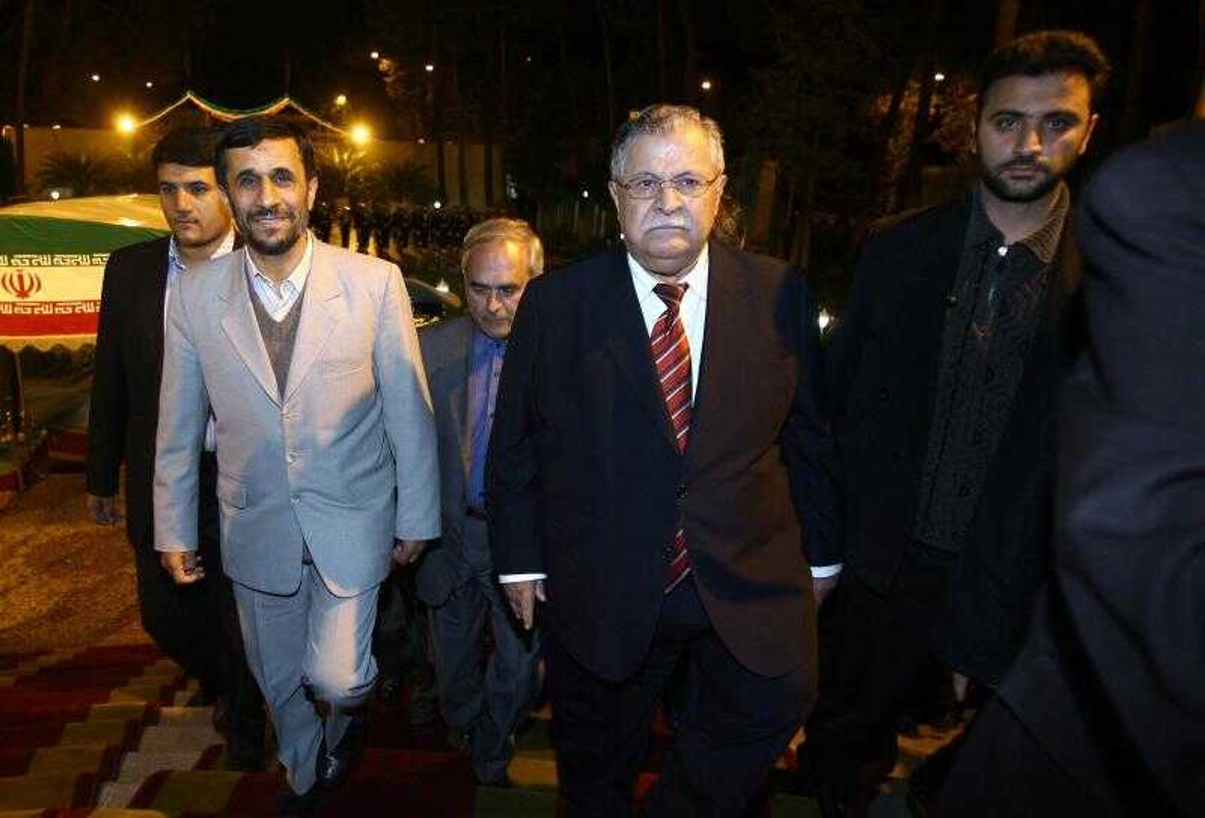 Iranian President Mahmoud Ahmadinejad, left, and Iraqi President Jalal Talabani, center, arrived for their meeting in Tehran, Iran, Monday. Iraqi President Jalal Talabani sought Monday to enlist Iran's help in quelling the spiraling violence that threatens to tear his country apart. (Mehdi Ghasemi ~ Associated Press)