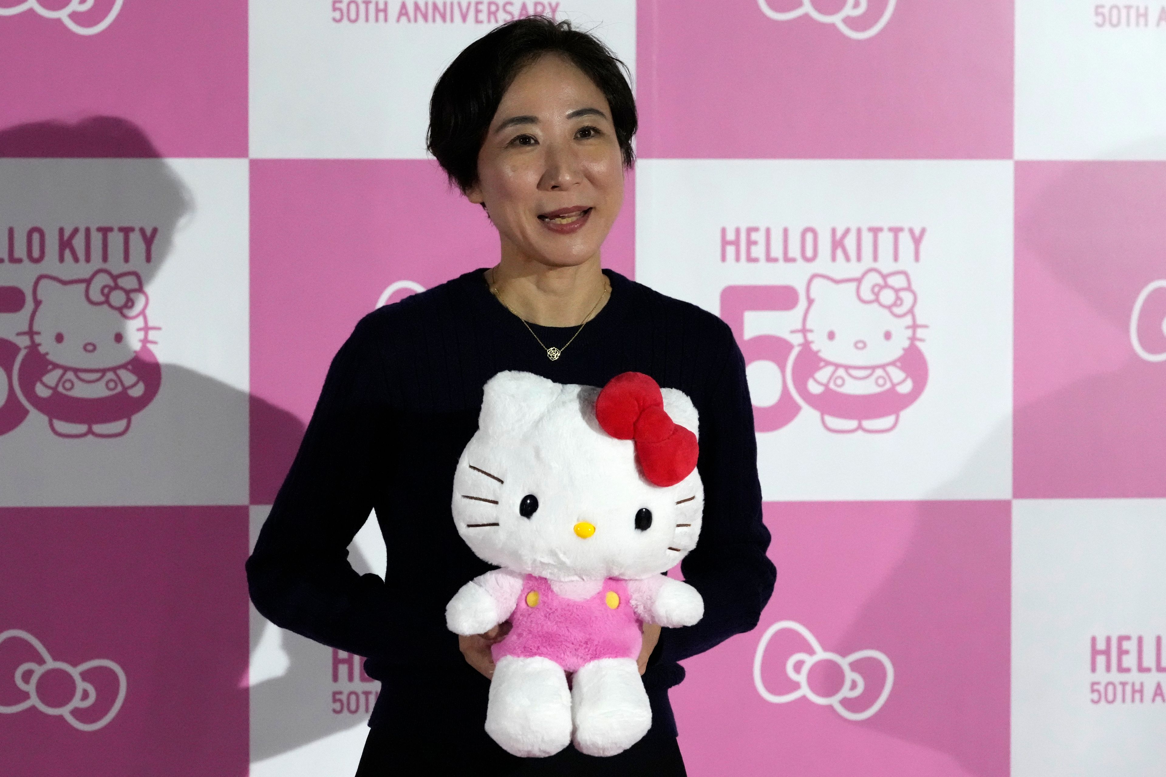 Yuko Akiyama, one of the directors at Sanrio, speaks to the media during the exhibition "As I change, so does she," marking the 50th anniversary of Hello Kitty at the Tokyo National Museum in Tokyo Wednesday, Oct. 30, 2024. (AP Photo/Shuji Kajiyama)