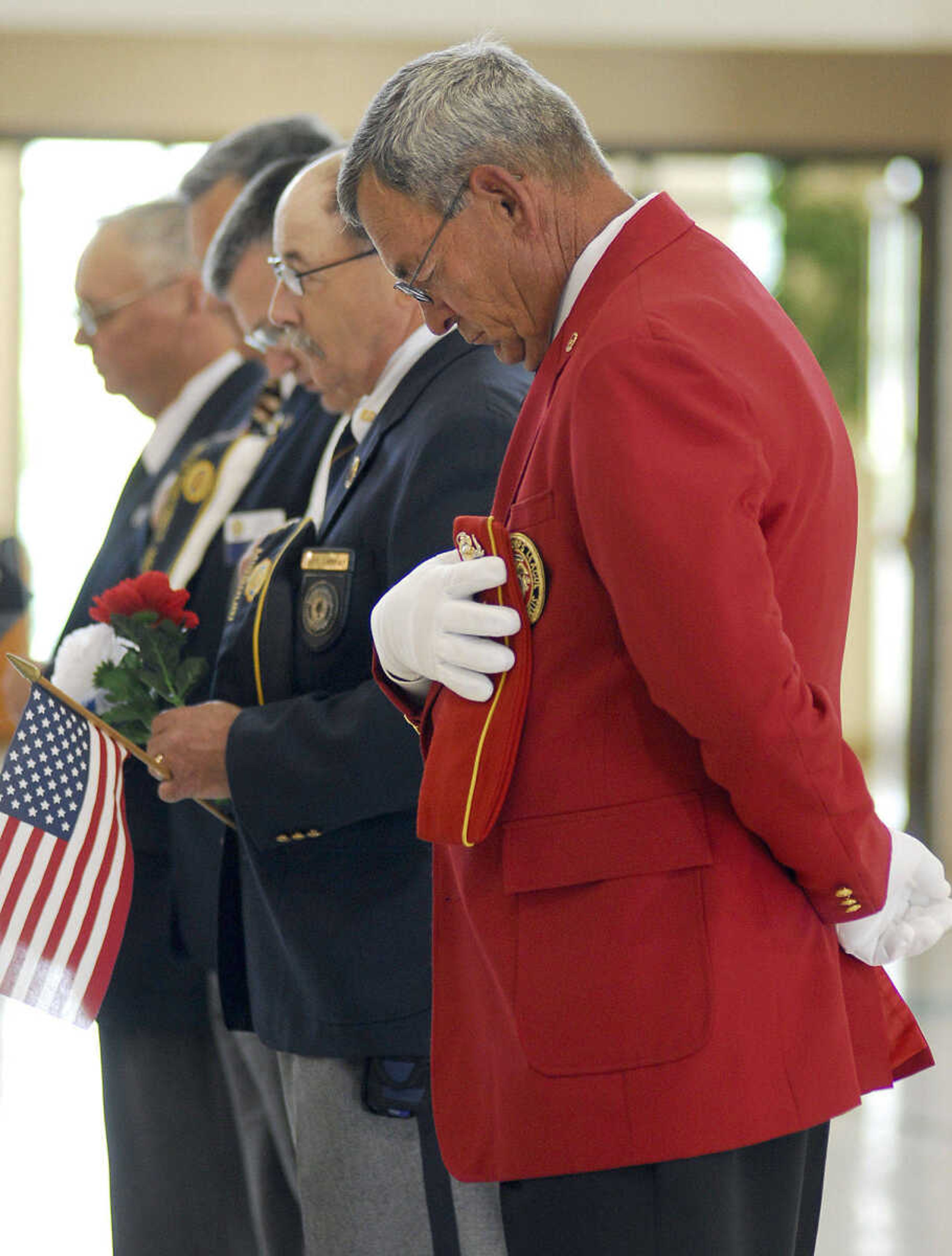 LAURA SIMON~lsimon@semissourian.com
Veterans bow their heads during the benediction Monday, May 31, 2010 during the Memorial Day Program at the Osage Community Centre.