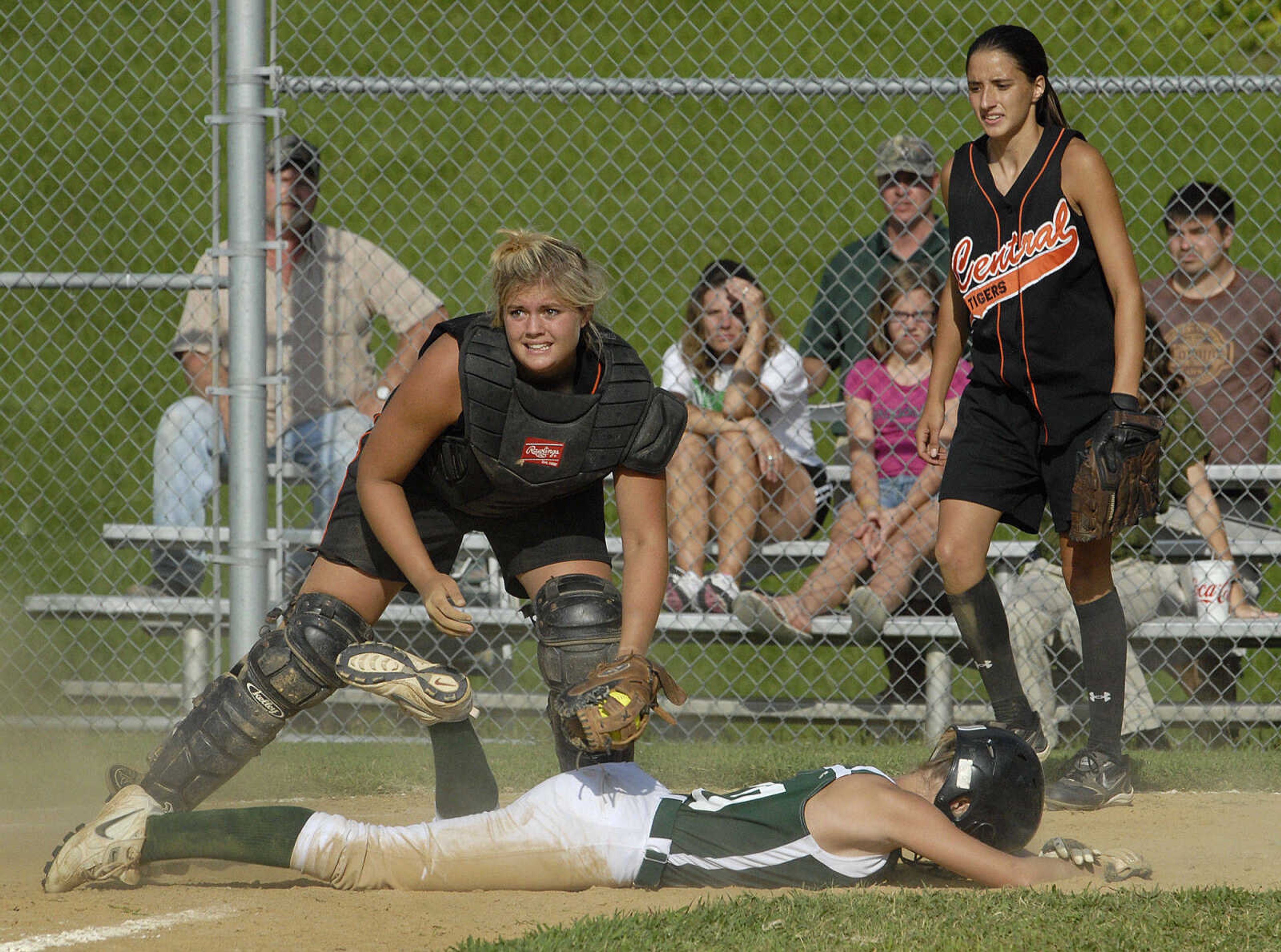 FRED LYNCH ~ flynch@semissourian.com
Central catcher Taylre Scott tags out Perryville's Brittany Young at the plate as pitcher Victoria Schabbing backs her up in the fourth inning Monday at Central.