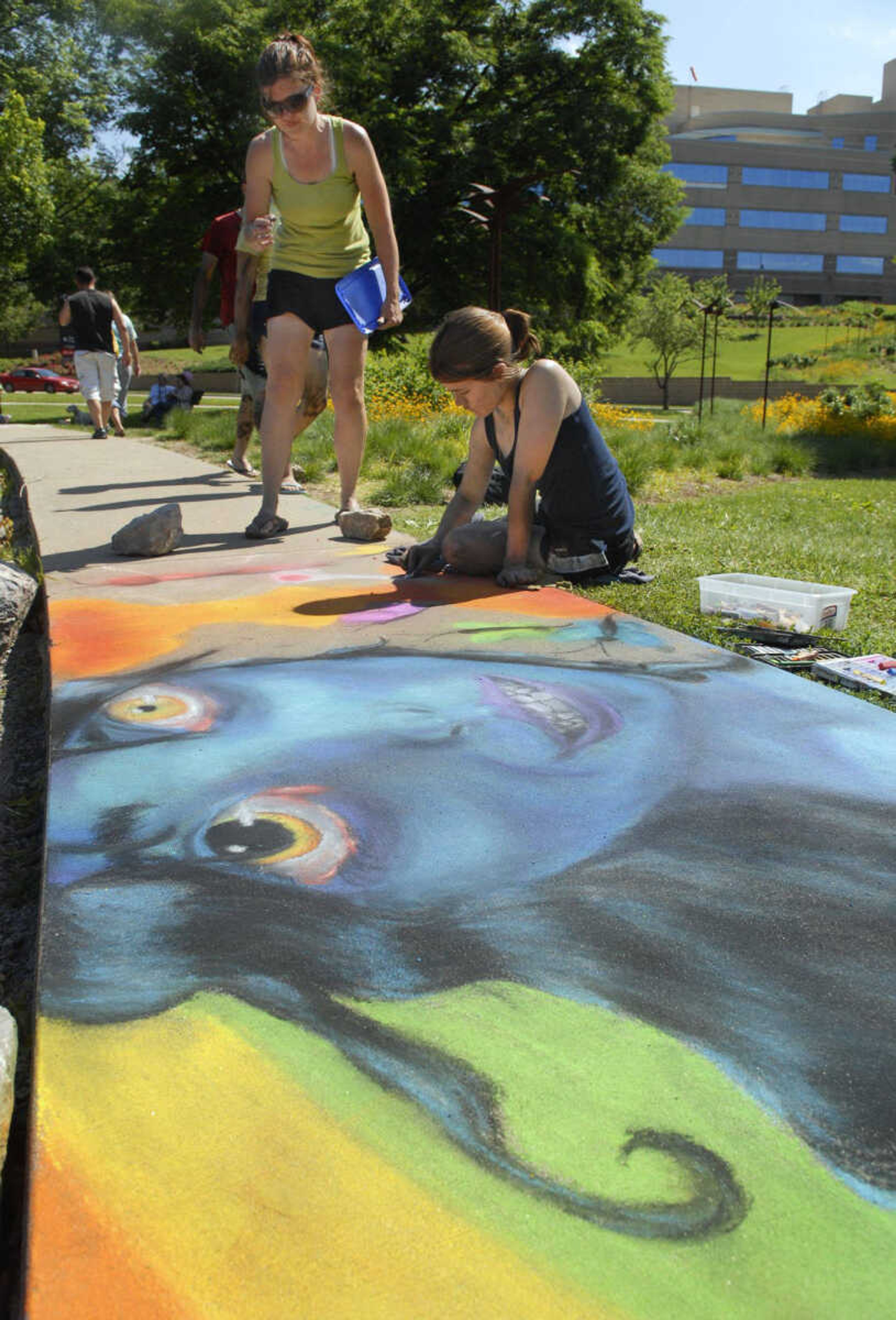 KRISTIN EBERTS ~ keberts@semissourian.com
Meg Fridley works to finish her masterpiece as mother Stephanie Fridley watches during ArtsCape at Capaha Park in Cape Girardeau, Mo., on Saturday, May 22, 2010. Fridley won first place in the teen category of the competition.