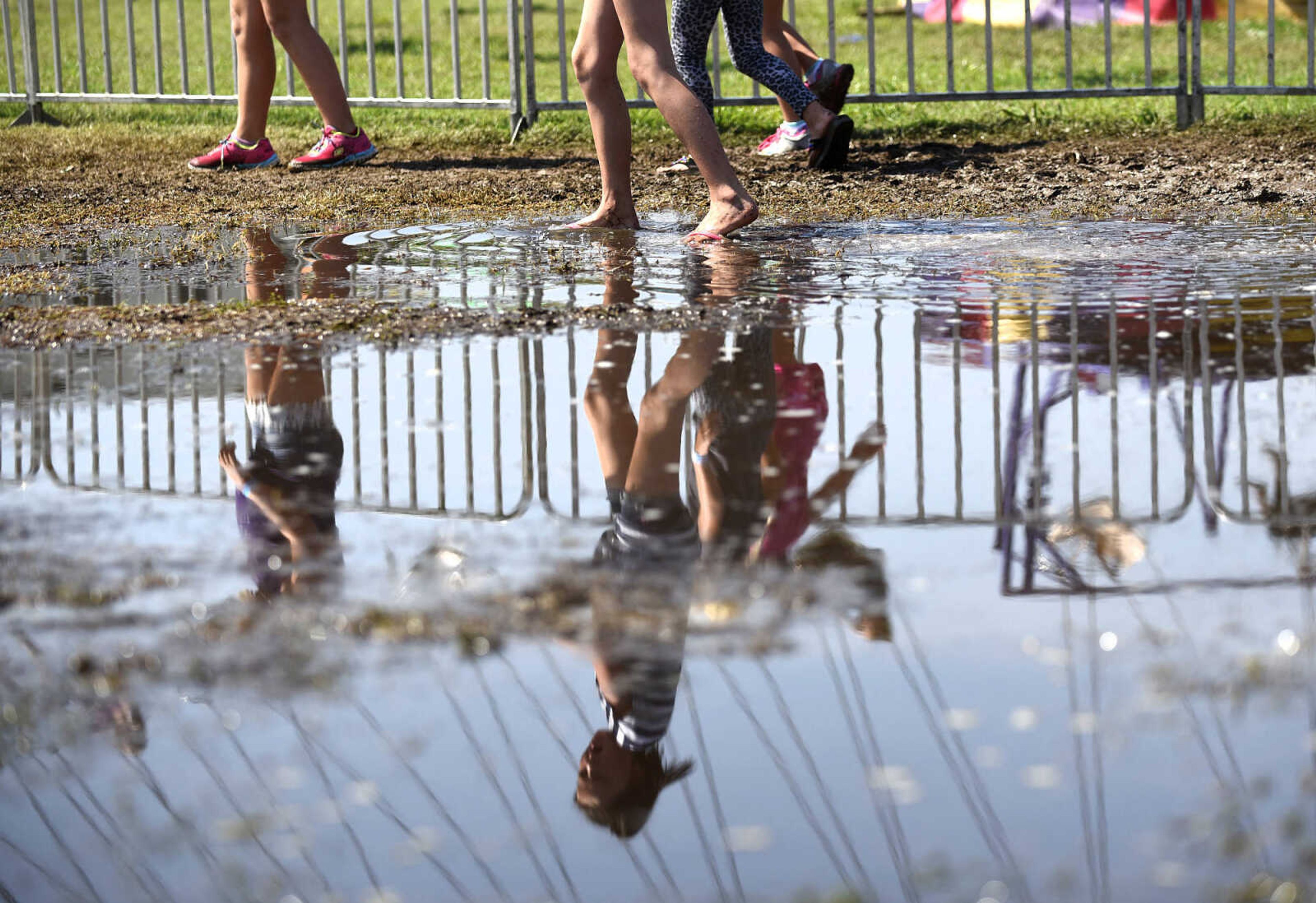 LAURA SIMON ~ lsimon@semissourian.com

A couple of days with heat downpours have created wet obstacles in the midway during the SEMO District Fair as seen on Friday, Sept. 16, 2016, at Arena Park in Cape Girardeau.