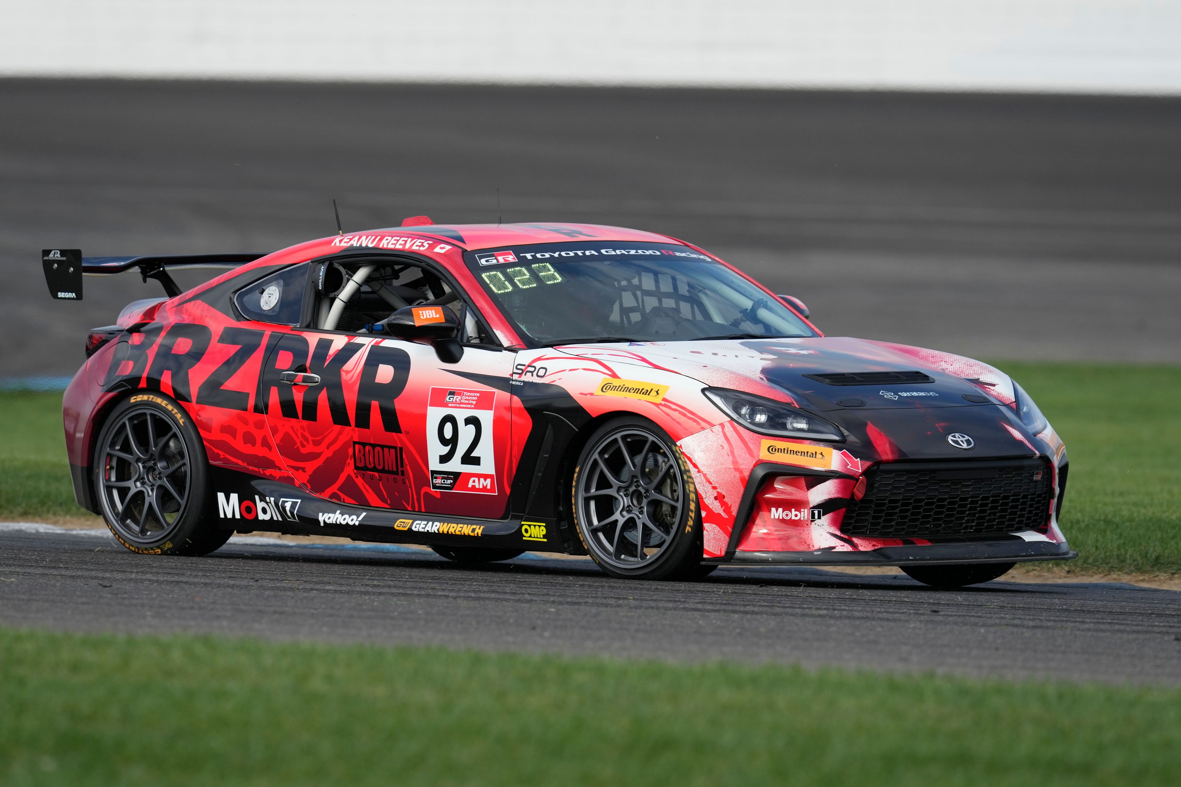 Keanu Reeves drives during the GR Cup Series auto race at Indianapolis Motor Speedway, Saturday, Oct. 5, 2024, in Indianapolis. (AP Photo/Darron Cummings)