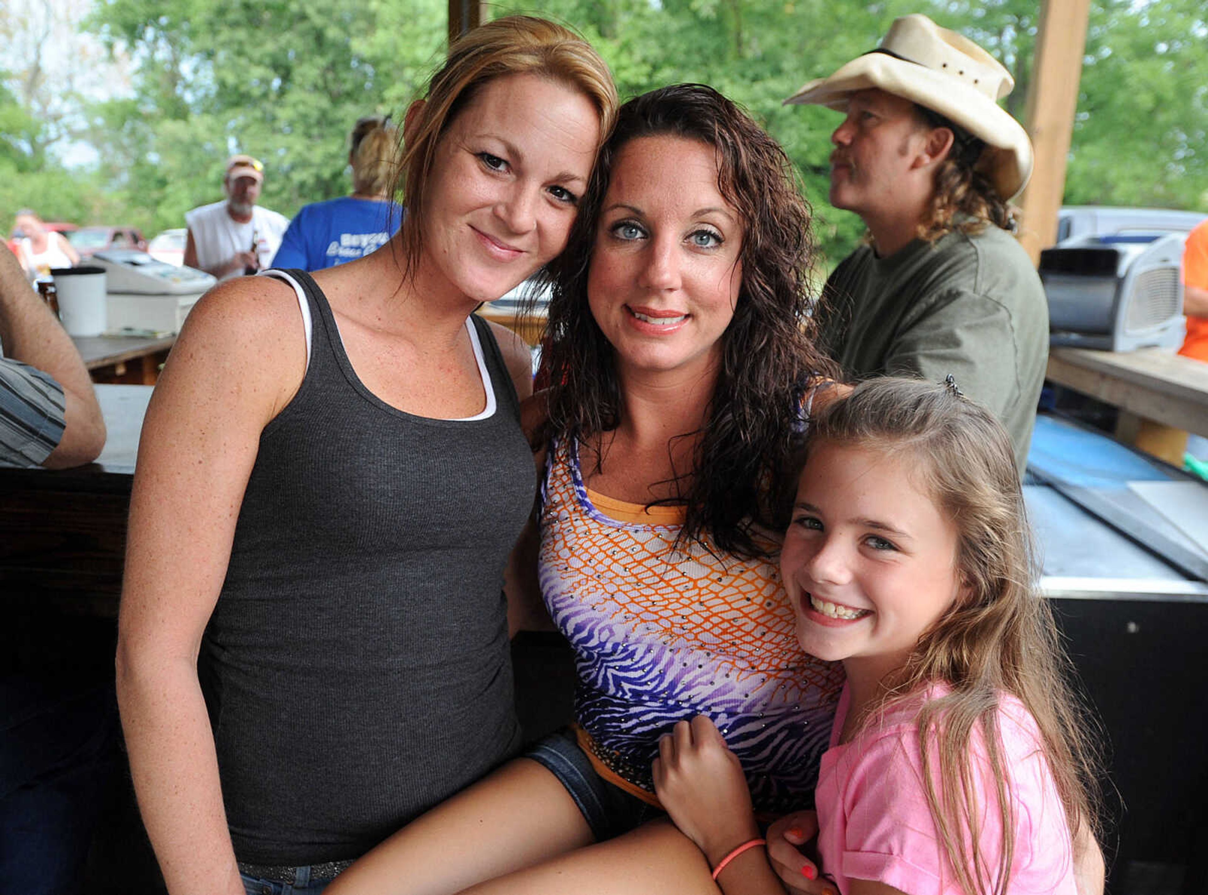 LAURA SIMON ~ lsimon@semissourian.com
Amelia Tillman, Shannon Gilmore and Sydney Wiggins pose for a photo as the Backstreet Cruisers perform Sunday, July 8, 2012 at the Bayou Bar & Grill in Pocahontas, Mo. The St. Louis based band performs music from the 1950's and 60's.