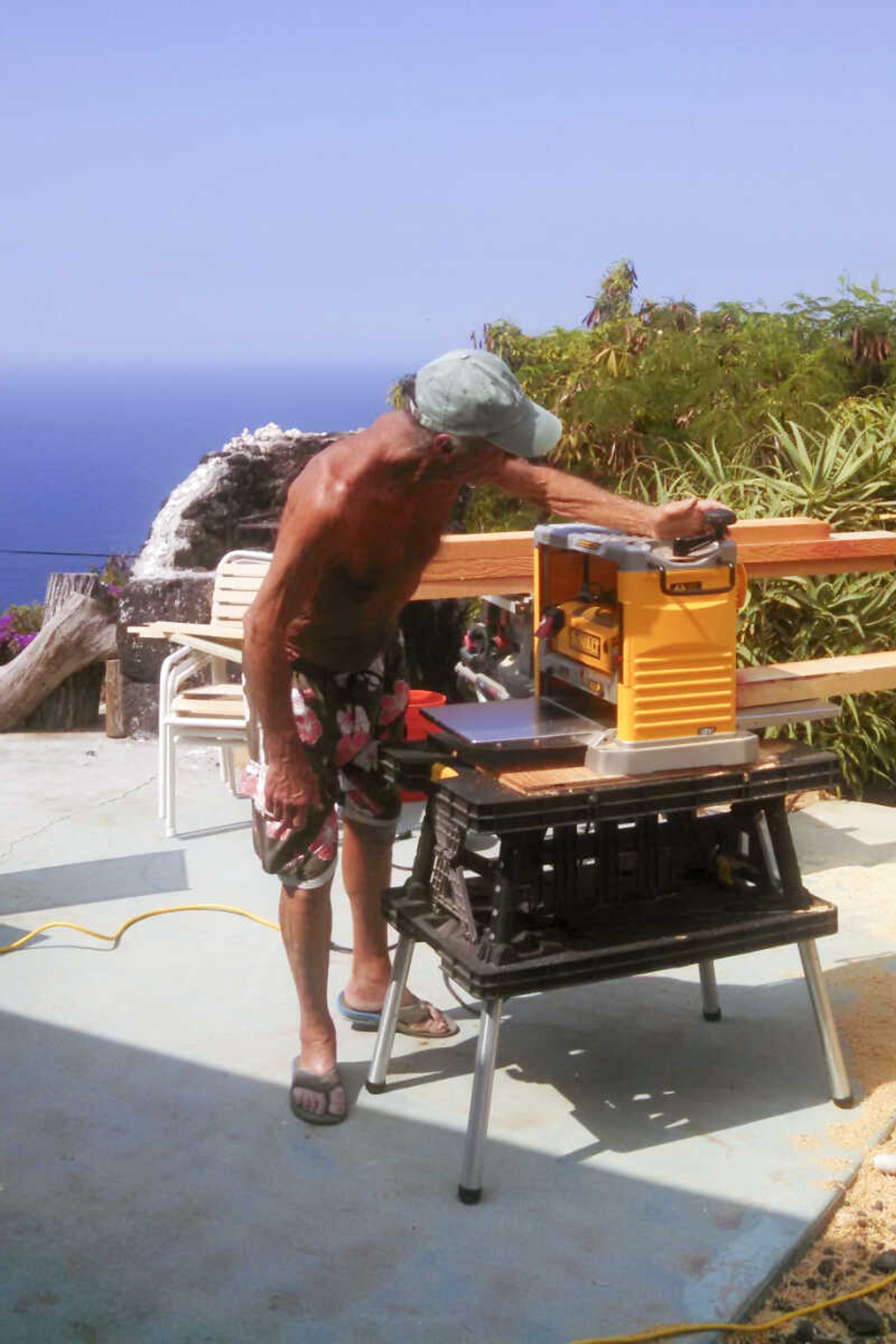 This circa 2011 image provided by Pam Brodersen shows Paul Kasprzycki working on a lanai project in South Kona, Hawaii. The death toll from the wildfire that destroyed the historic Hawaii town of Lahaina in August rose to 101 on Tuesday, Feb. 13, 2024, after Maui police confirmed the identity of one new victim, Paul Kasprzycki of Lahaina. Kasprzycki was one of three people still missing from the Aug. 8, 2023, blaze. (Pam Brodersen via AP)