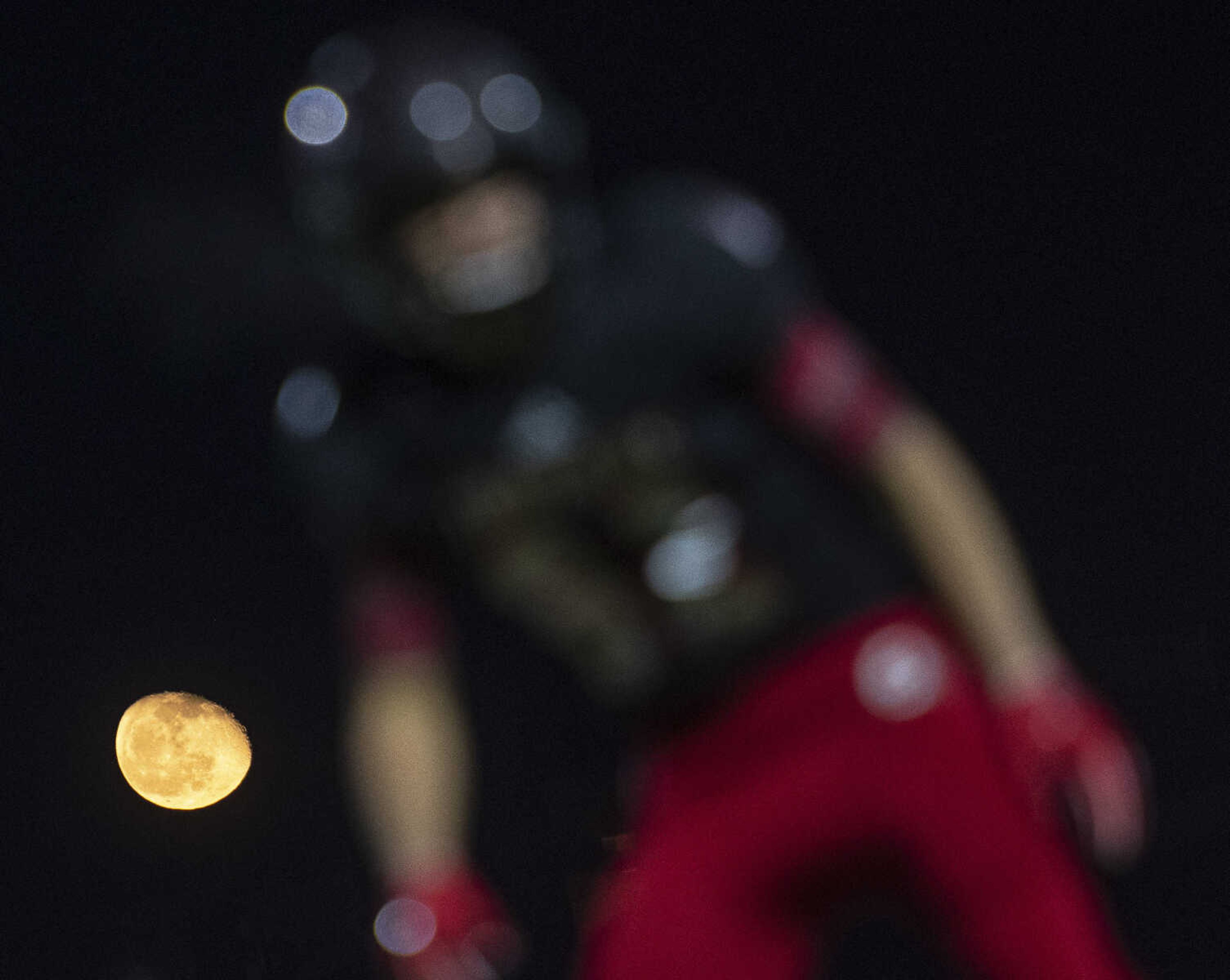 The moon is pictured with a Jackson Indian during the Jackson Indians' matchup against the Fox Warriors in the Class 5 District 1 championship Friday, Nov. 15, 2019, in Jackson.