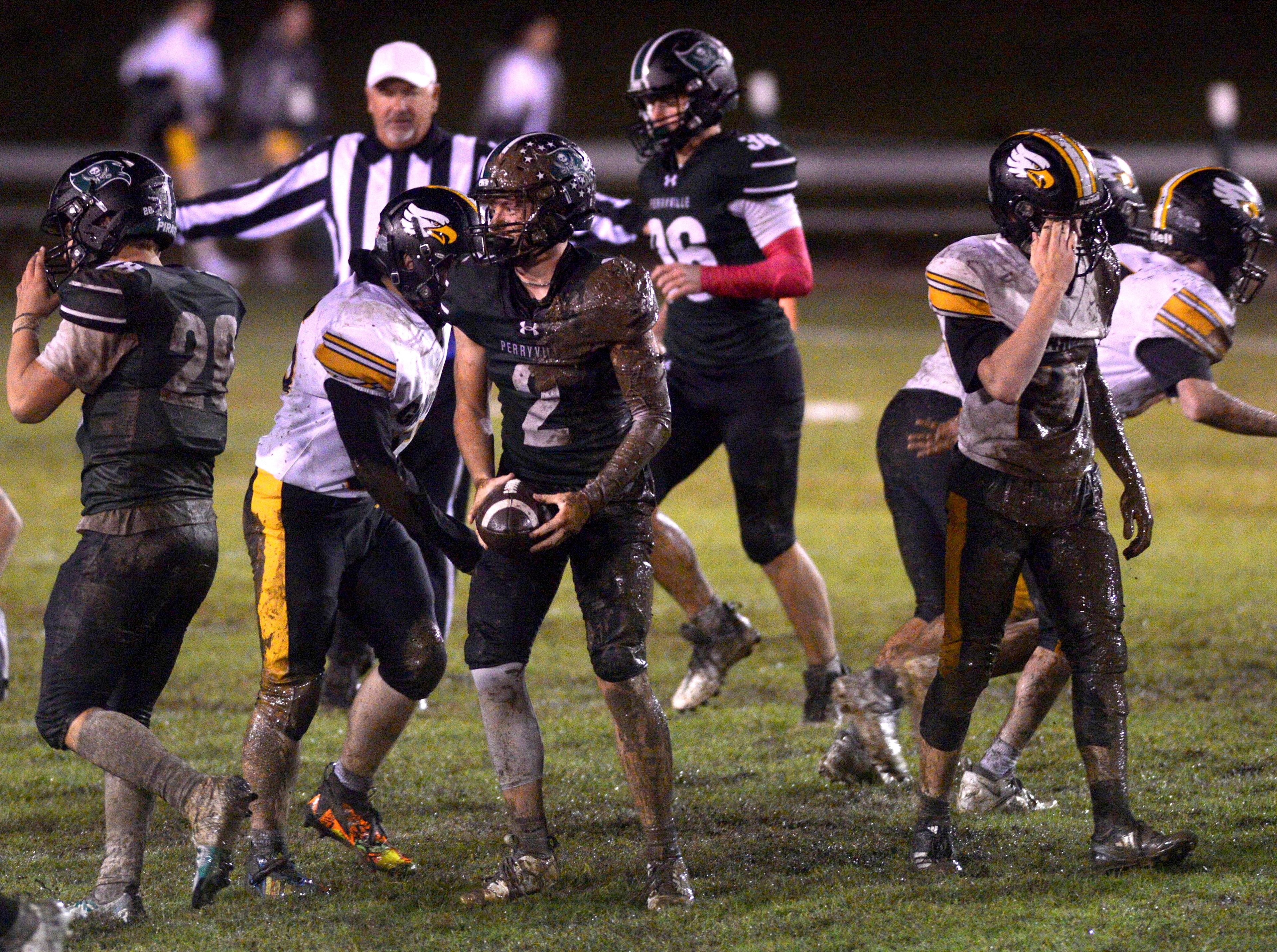 Perryville's Chase Richardet emerges from the mud after a play during a game against Grandview on Sept. 26, in Perryville. 