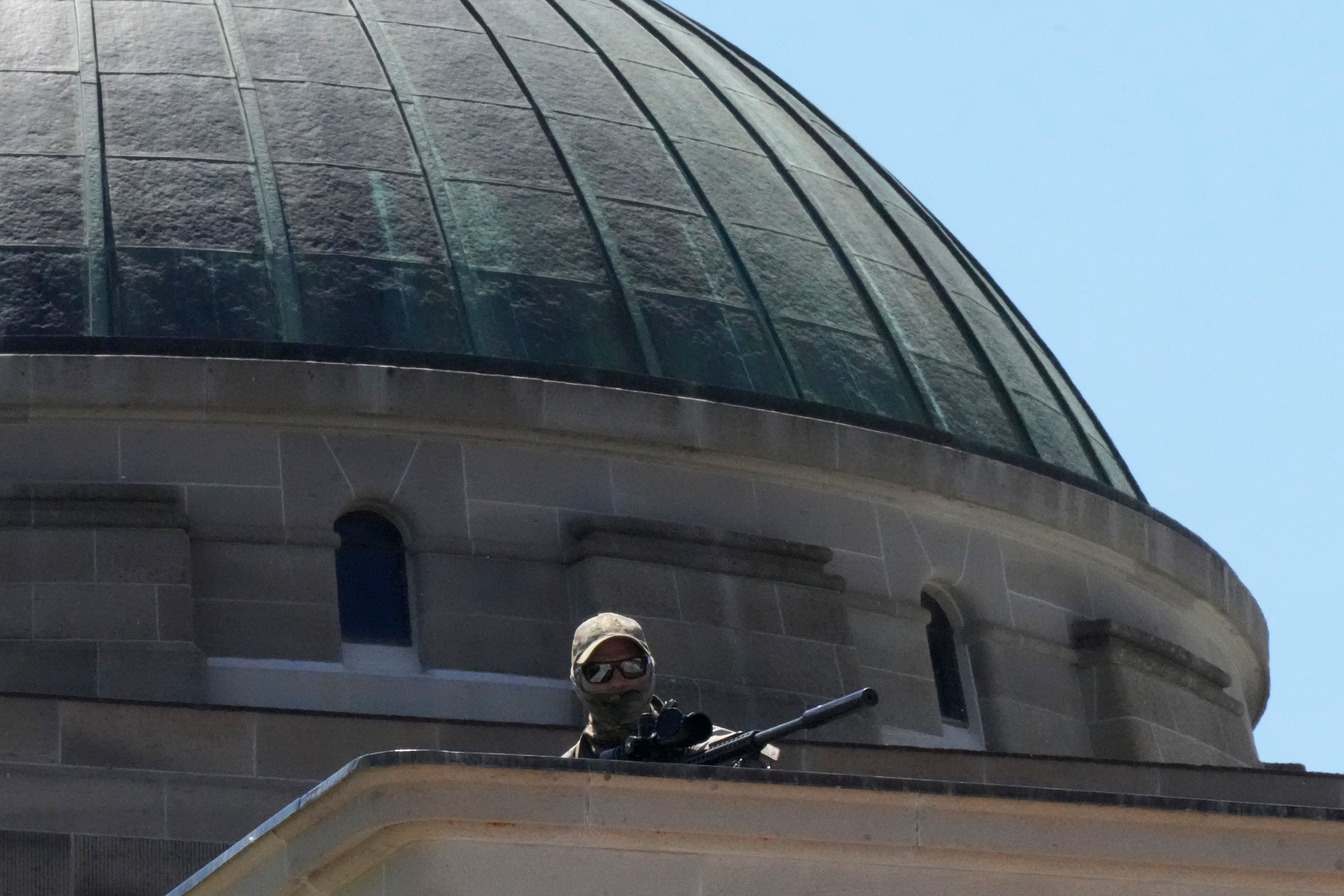 Sniper from security forces on position at Australian War Memorial ahead of Britain's King Charles and Queen Camilla visit in Canberra, Australia, Monday, Oct. 21, 2024. (AP Photo/Mark Baker, Pool)