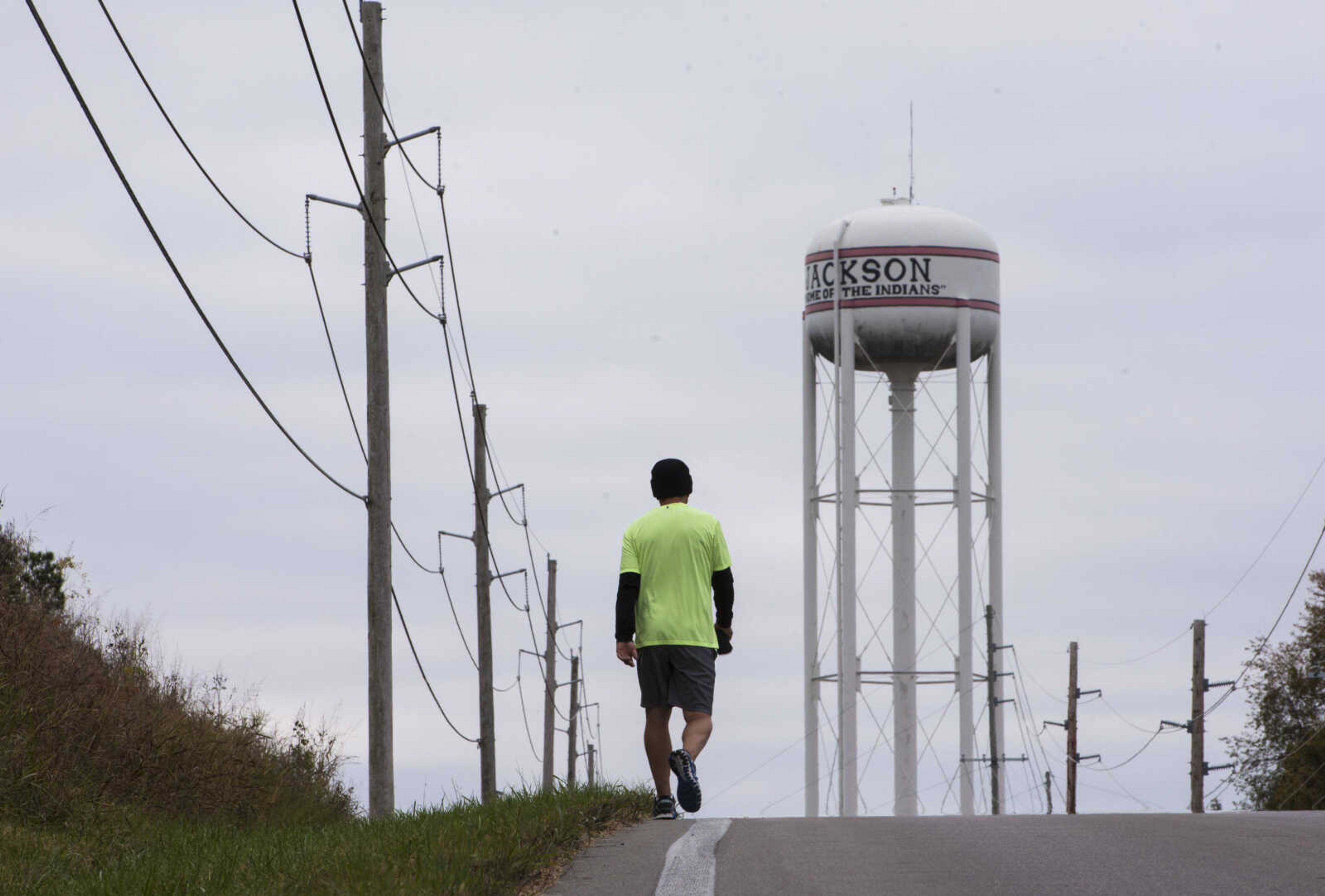 Jeff Cox walks uphill during the first Ghost and Goblin Gallop 5k race to raise money for the Crossroads Backpack Fair on Saturday, Oct. 28, 2017 in Jackson.