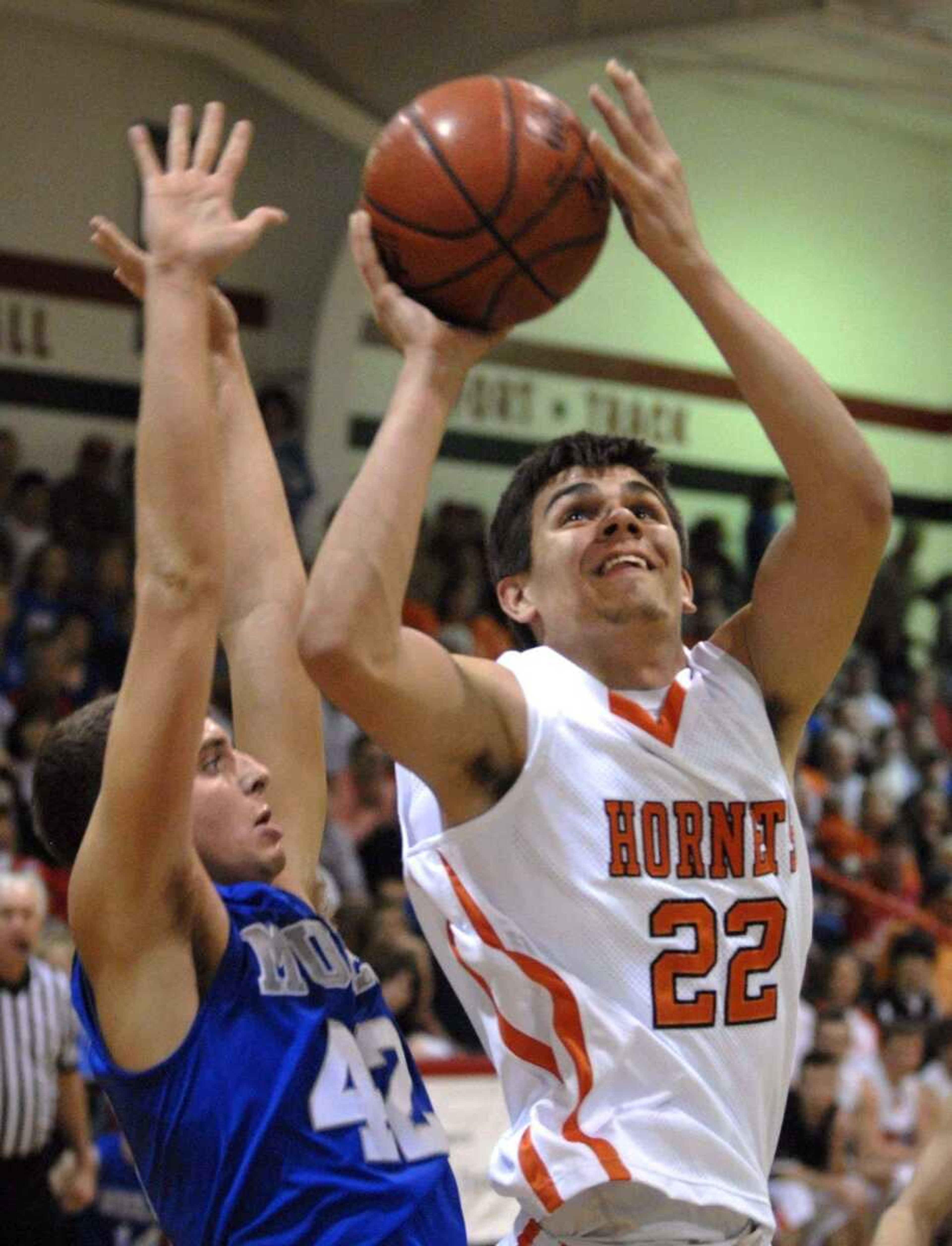 Advance's David VanGennip shoots as Bernie's Jake Smith defends during their Class 2 District 3 championship game Thursday at Chaffee.<br><B><br>FRED LYNCH </B>flynch@ semissourian.com