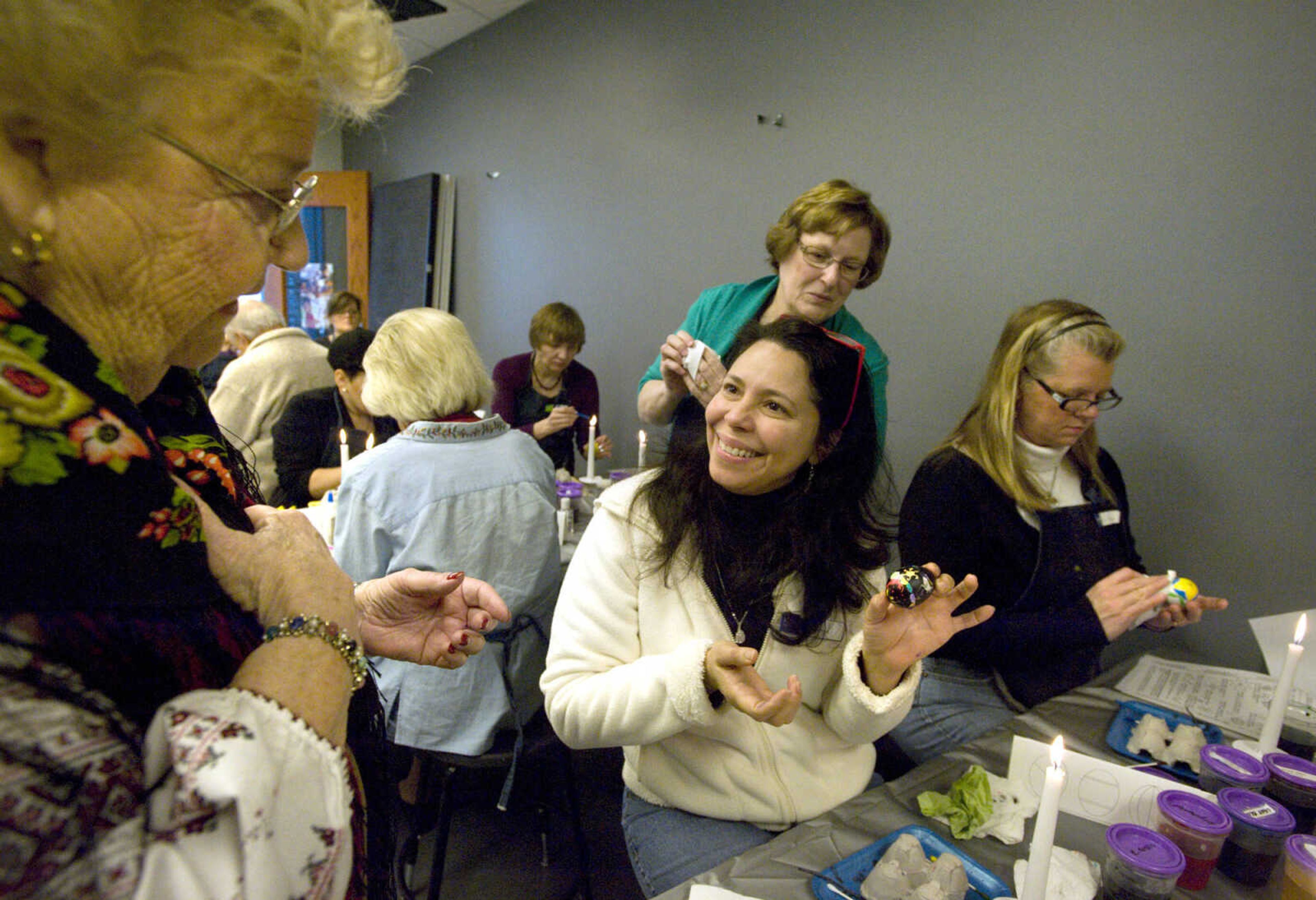 LAURA SIMON ~ lsimon@semissourian.com
Millie Davidson shows off her finished egg to instructor Barb Duncan Tuesday, March 19, 2013 during the Wonderful World of Pysanky workshop at Southeast Missouri State University's River Campus.