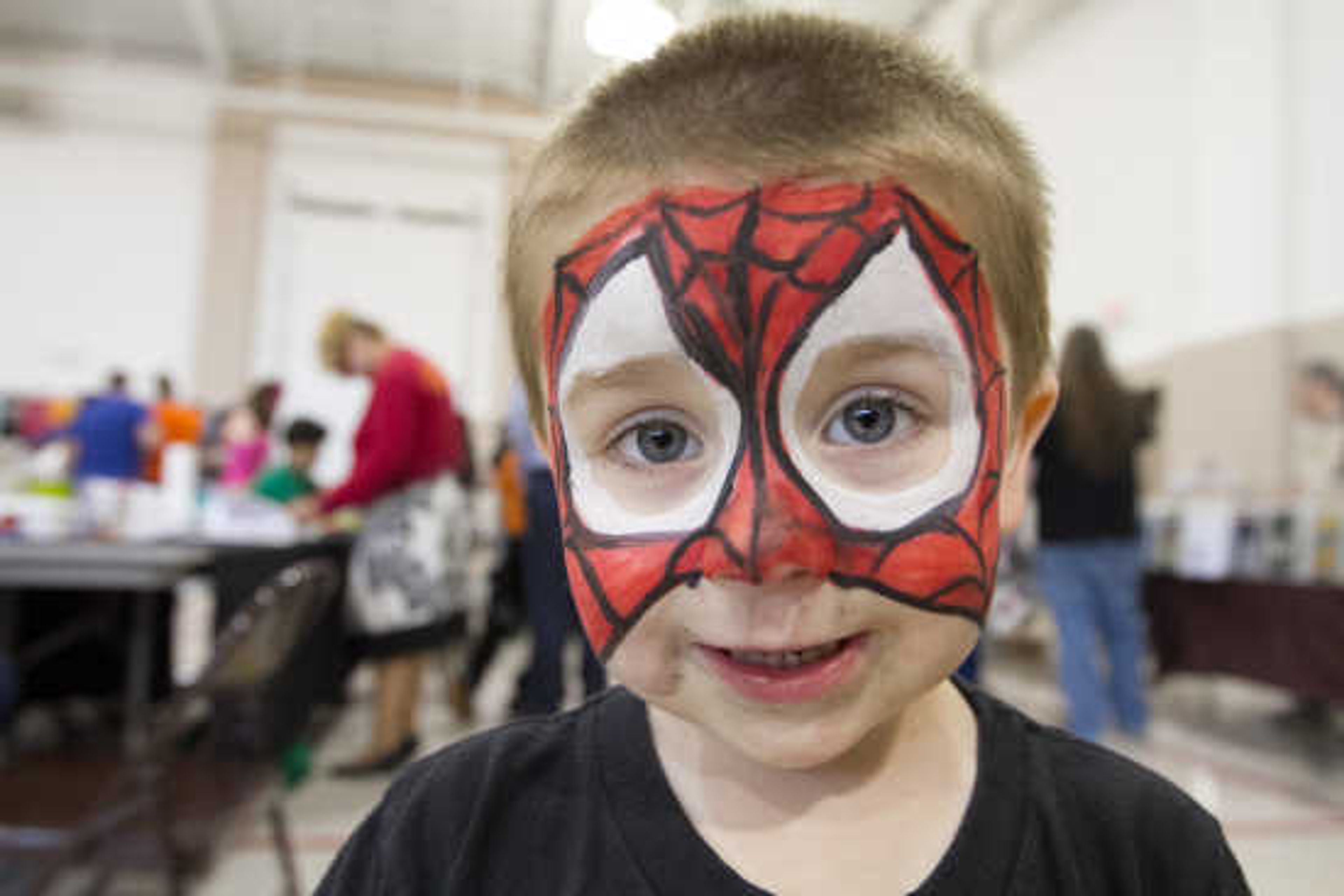 Dominic Souza poses for a photo after having his face painted as Spiderman during Cape Comic Con Friday, April 17, 2015, at the Osage Centre.