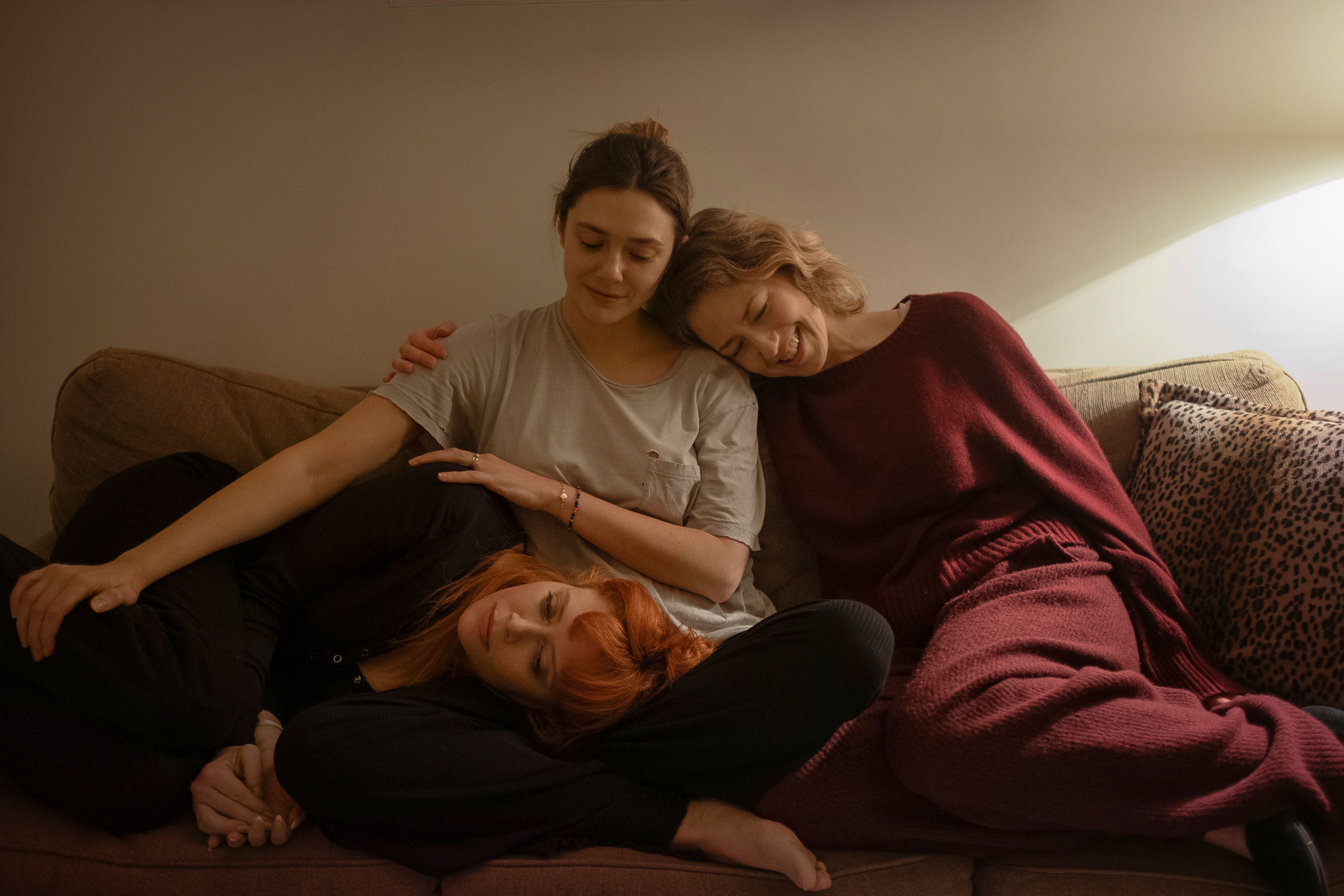 This image released by Netflix shows Natasha Lyonne, from left, Elizabeth Olsen, and Carrie Coon in a scene from "His Three Daughters." (Netflix via AP)