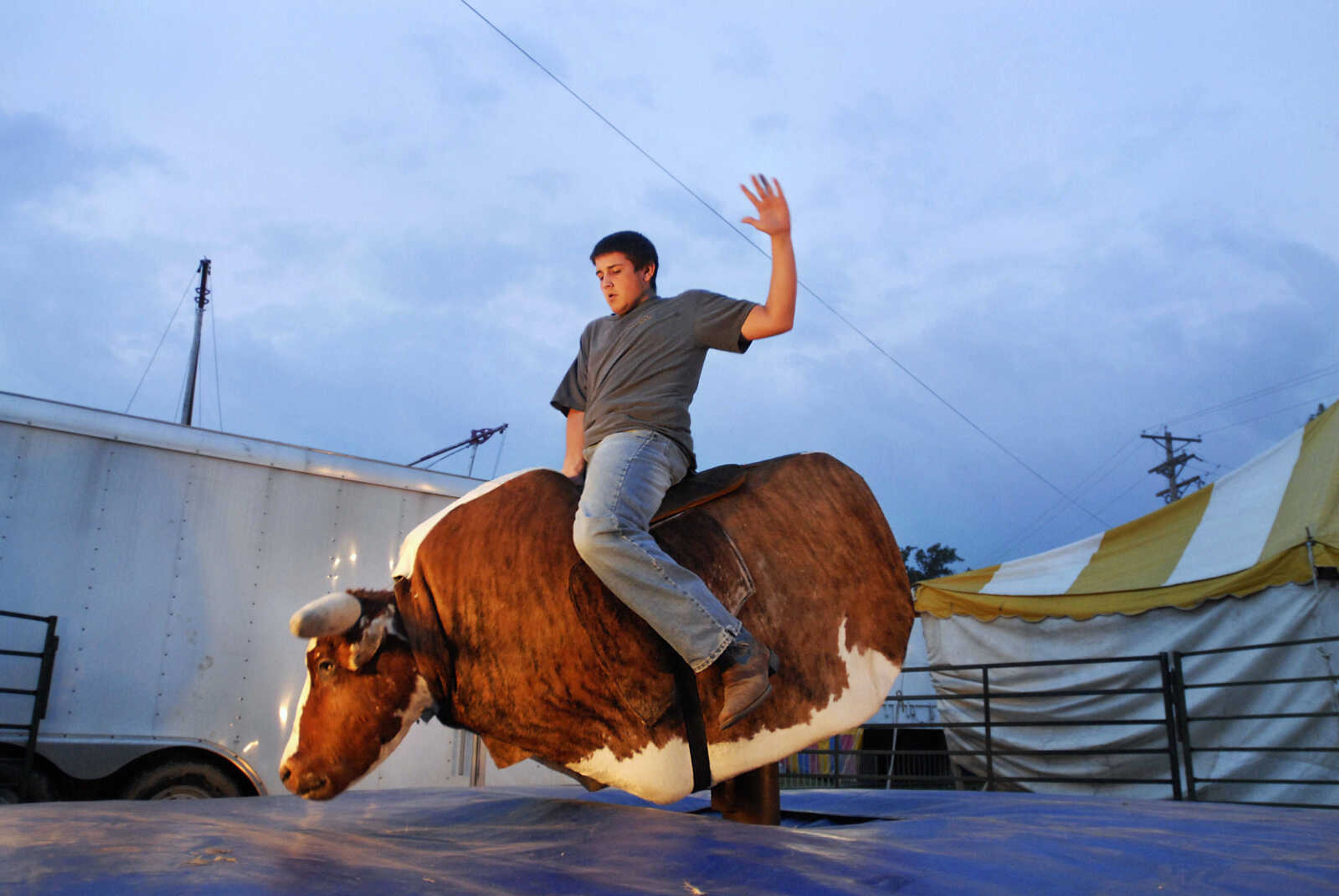 KRISTIN EBERTS ~ keberts@semissourian.com

Aaron Casey, 17, rides "Thunder Struck the Bull"  during the 155th SEMO District Fair on Wednesday, Sept. 15, 2010, at Arena Park in Cape Girardeau.