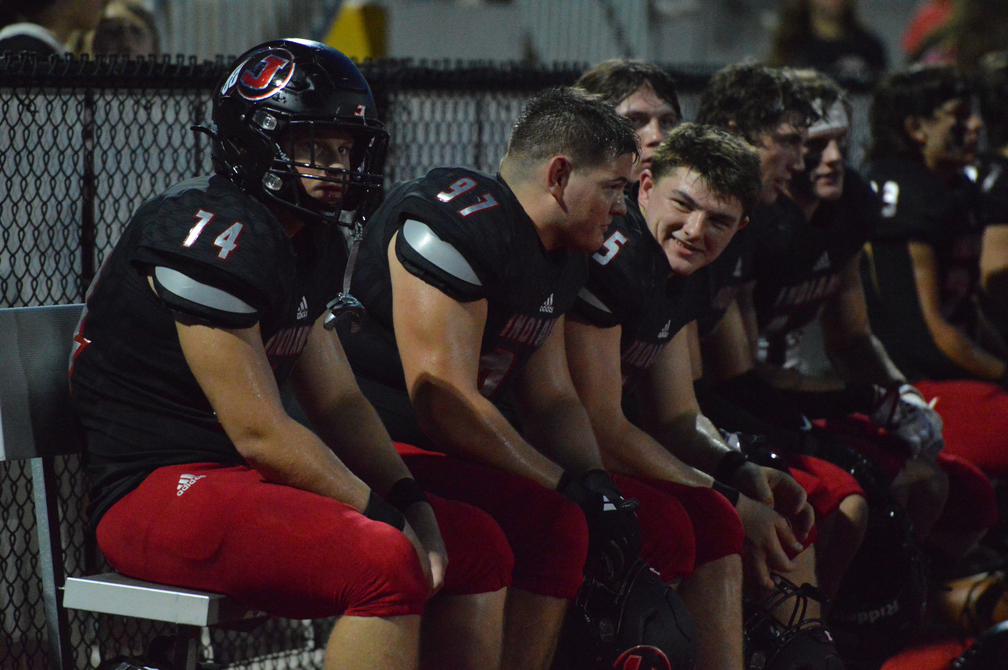 The Jackson defense gets a breather on the sideline in the first half against Farmington on Friday, Sept. 20.