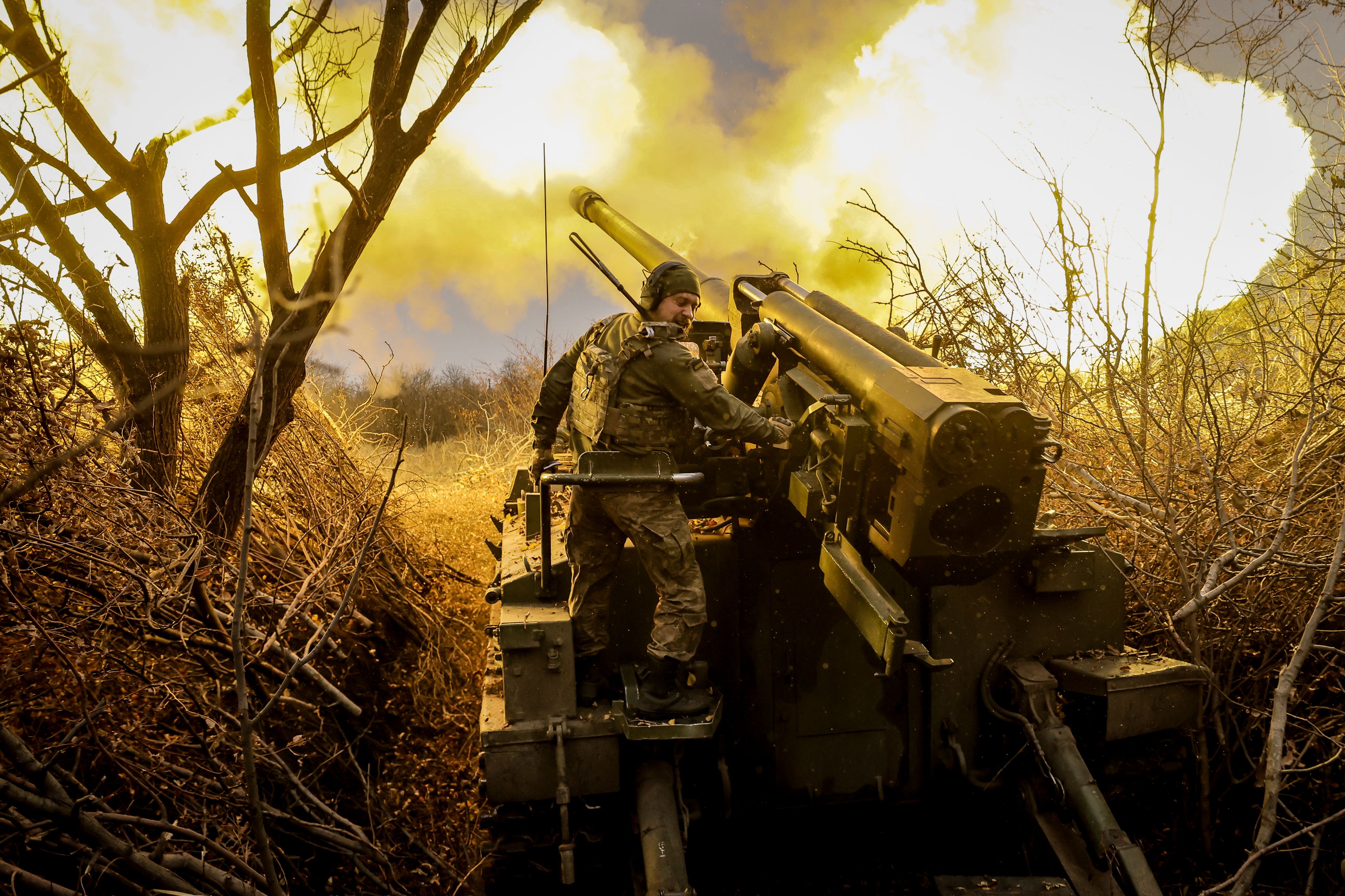 In this photo provided by Ukraine's 24th Mechanised Brigade press service, servicemen of the 24th Mechanised Brigade fire 2s5 self-propelled 152mm howitzer towards Russian positions near Chasiv Yar, Donetsk region, Ukraine, Monday, Nov. 18, 2024. (Oleg Petrasiuk/Ukrainian 24th Mechanised Brigade via AP)