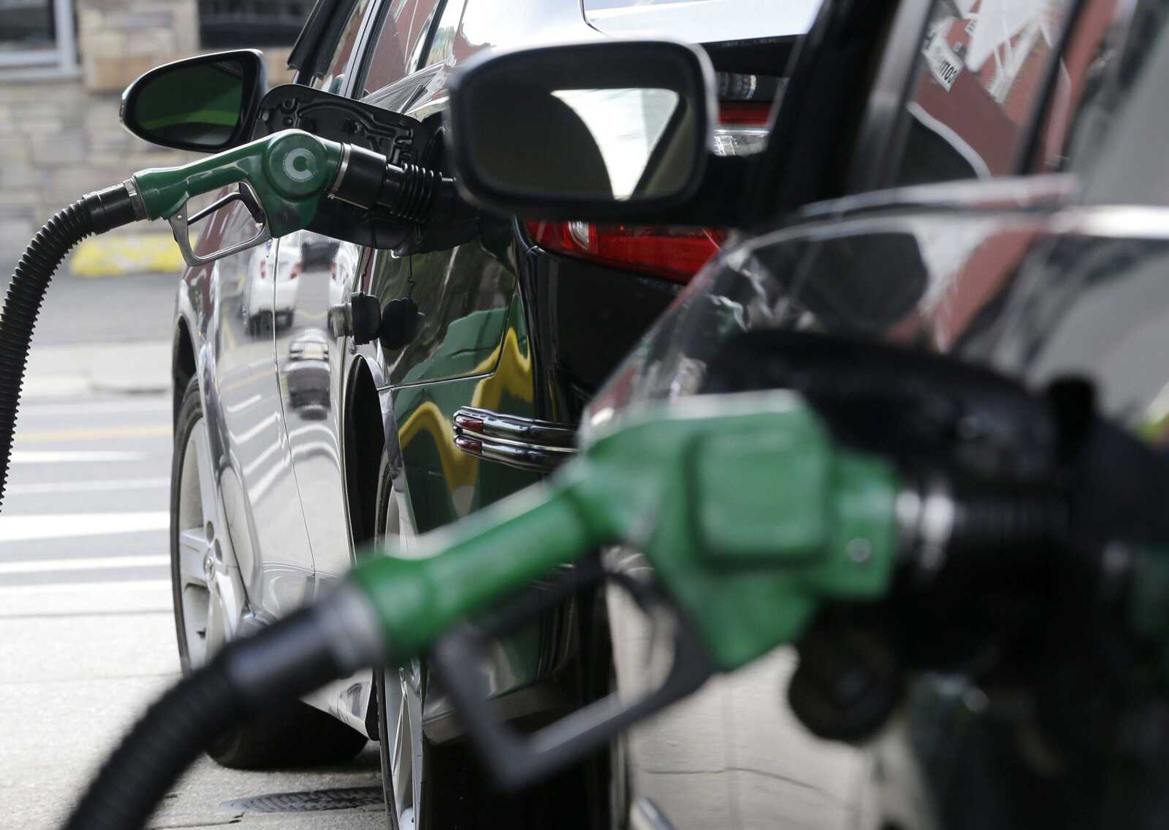 Gas is pumped into vehicles June 30 at a BP gas station in Hoboken, New Jersey.