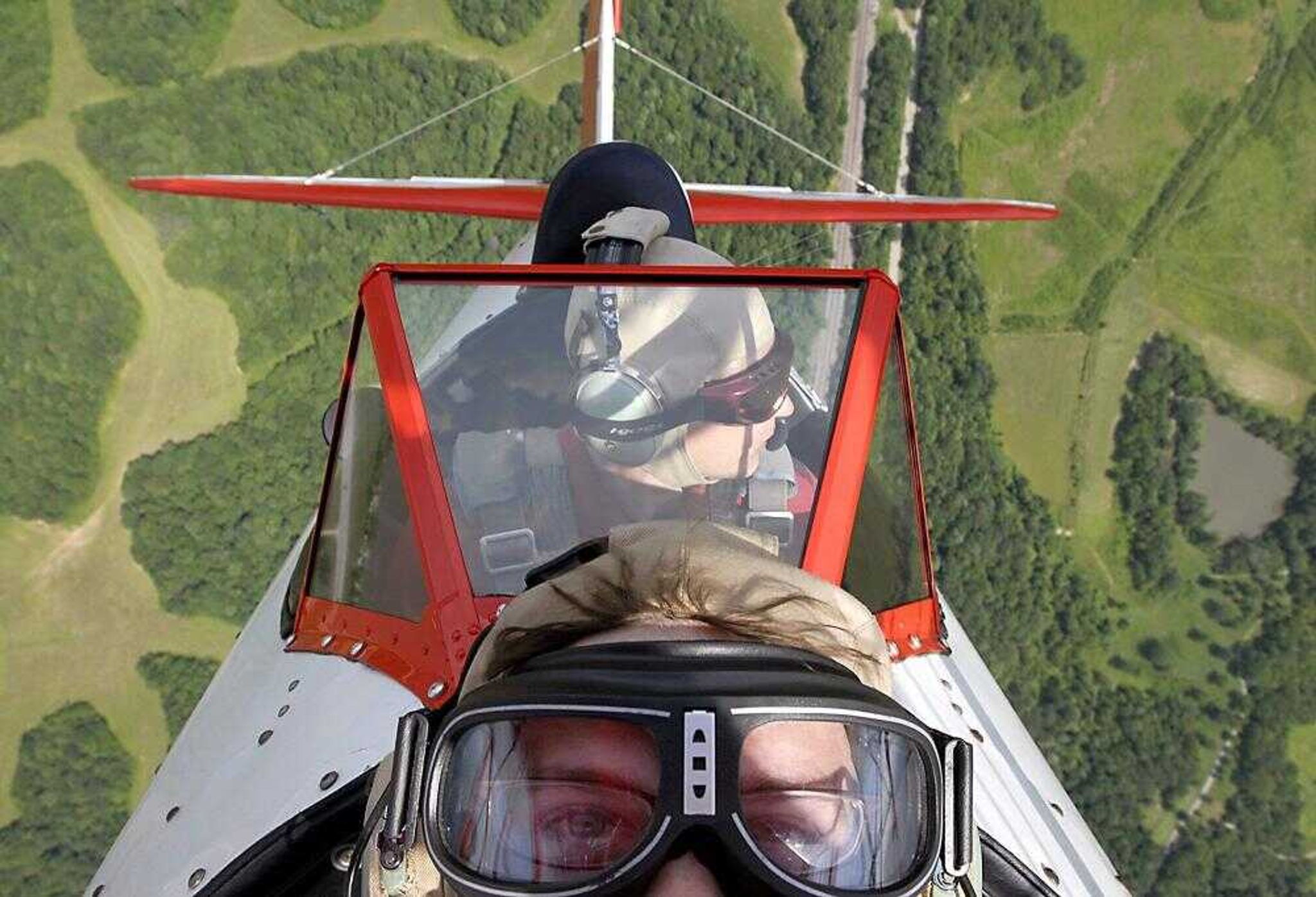 Pilot Ryan Mohr, back, performed a hammerhead maneuver during a flight Thursday. The Red Baron Pizza Squadron will perform at this weekend's Cape Girardeau Regional Air Festival. (Kit Doyle)