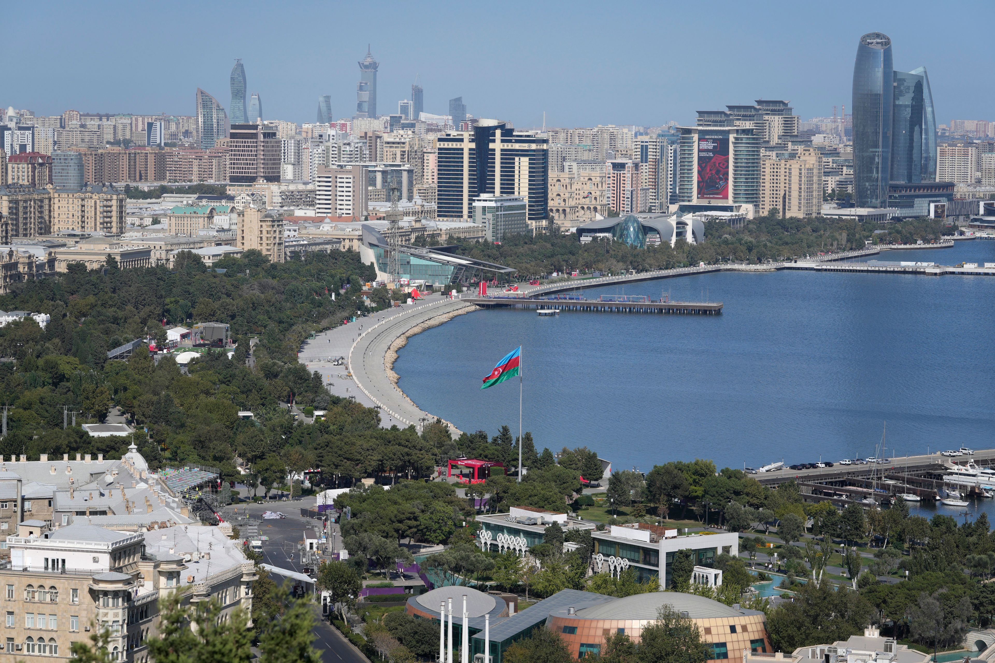 An Azerbaijan flag is displayed near Baku Bay, in Baku, Azerbaijan, Monday, Sept. 16, 2024. (AP Photo/Sergei Grits)