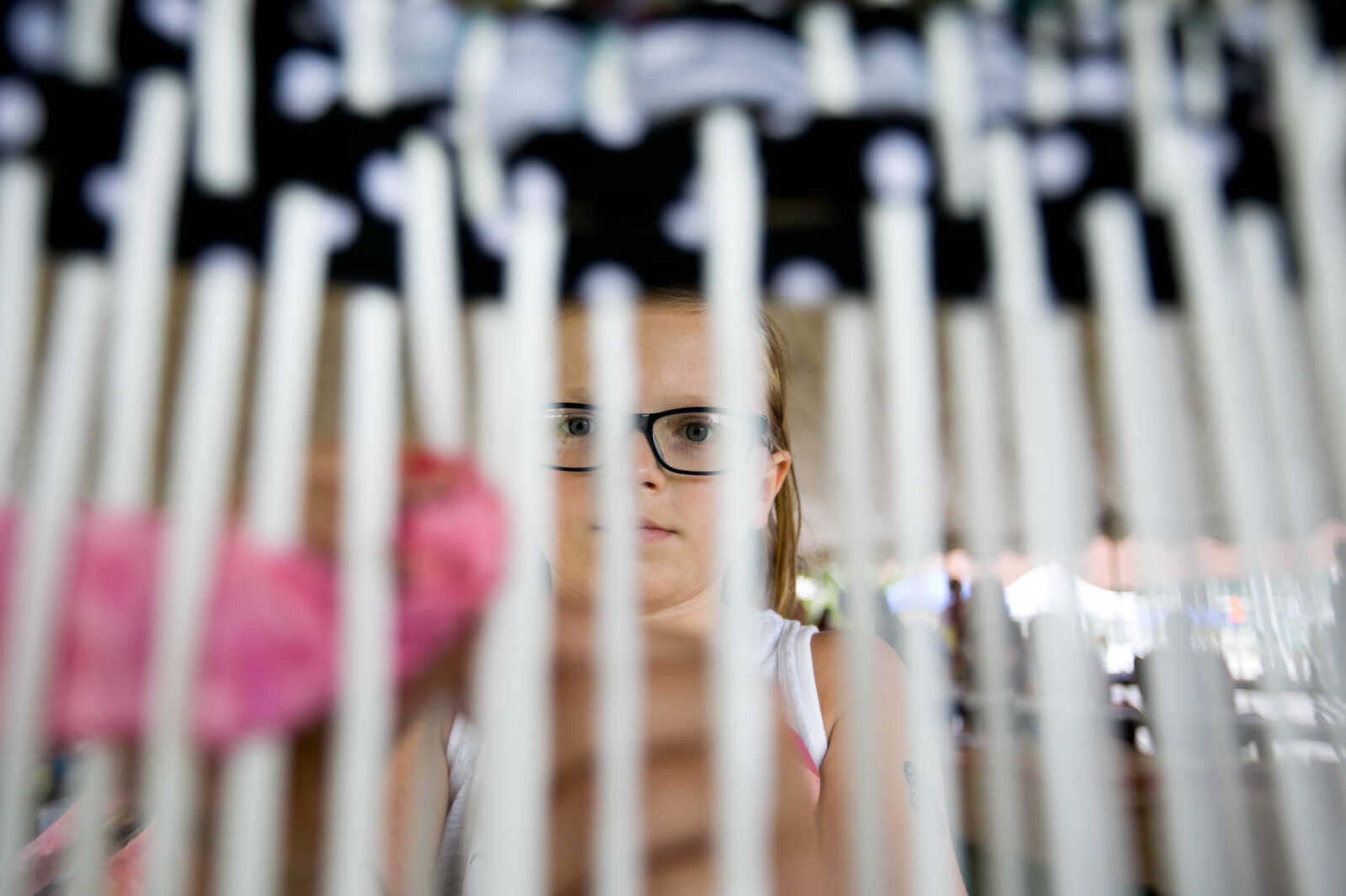 GLENN LANDBERG ~ glandberg@semissourian.com

Isabella Pattengill weaves a piece of fabric during a collaborative weaving project Saturday, June 18, 2016 at the River Campus Summer Arts Festival.