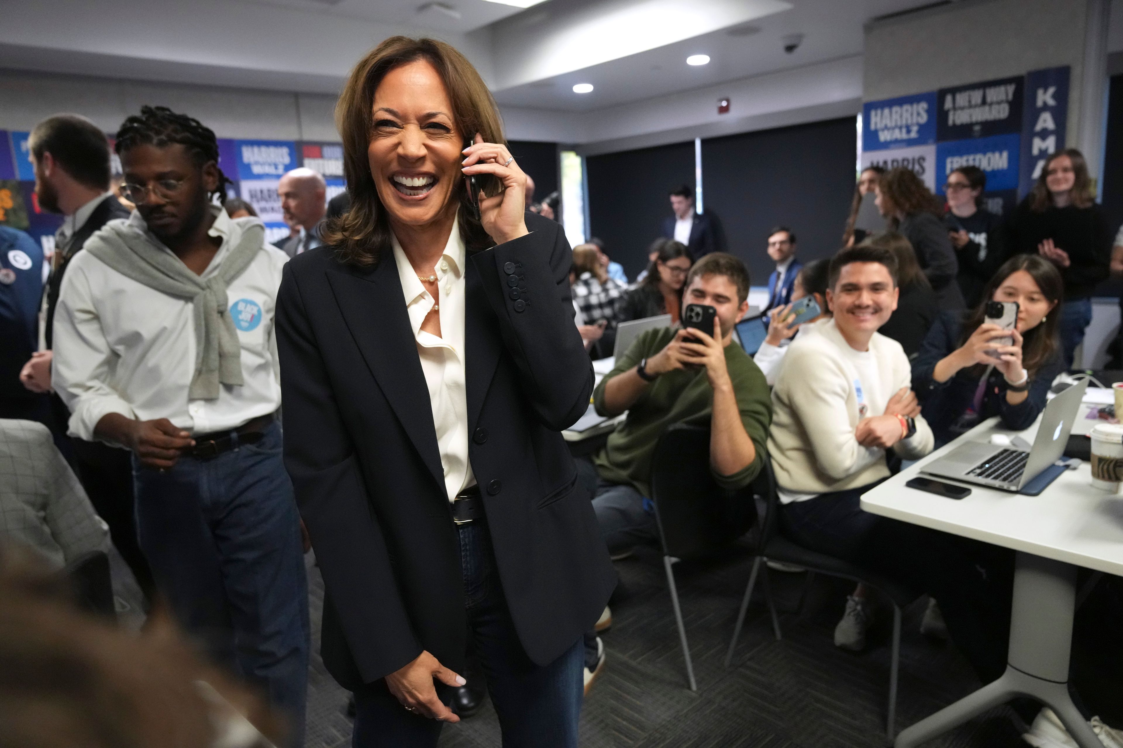 Democratic presidential nominee Vice President Kamala Harris, left, phone banks with volunteers at the DNC headquarters on Election Day, Tuesday, Nov. 5, 2024, in Washington. (AP Photo/Jacquelyn Martin)