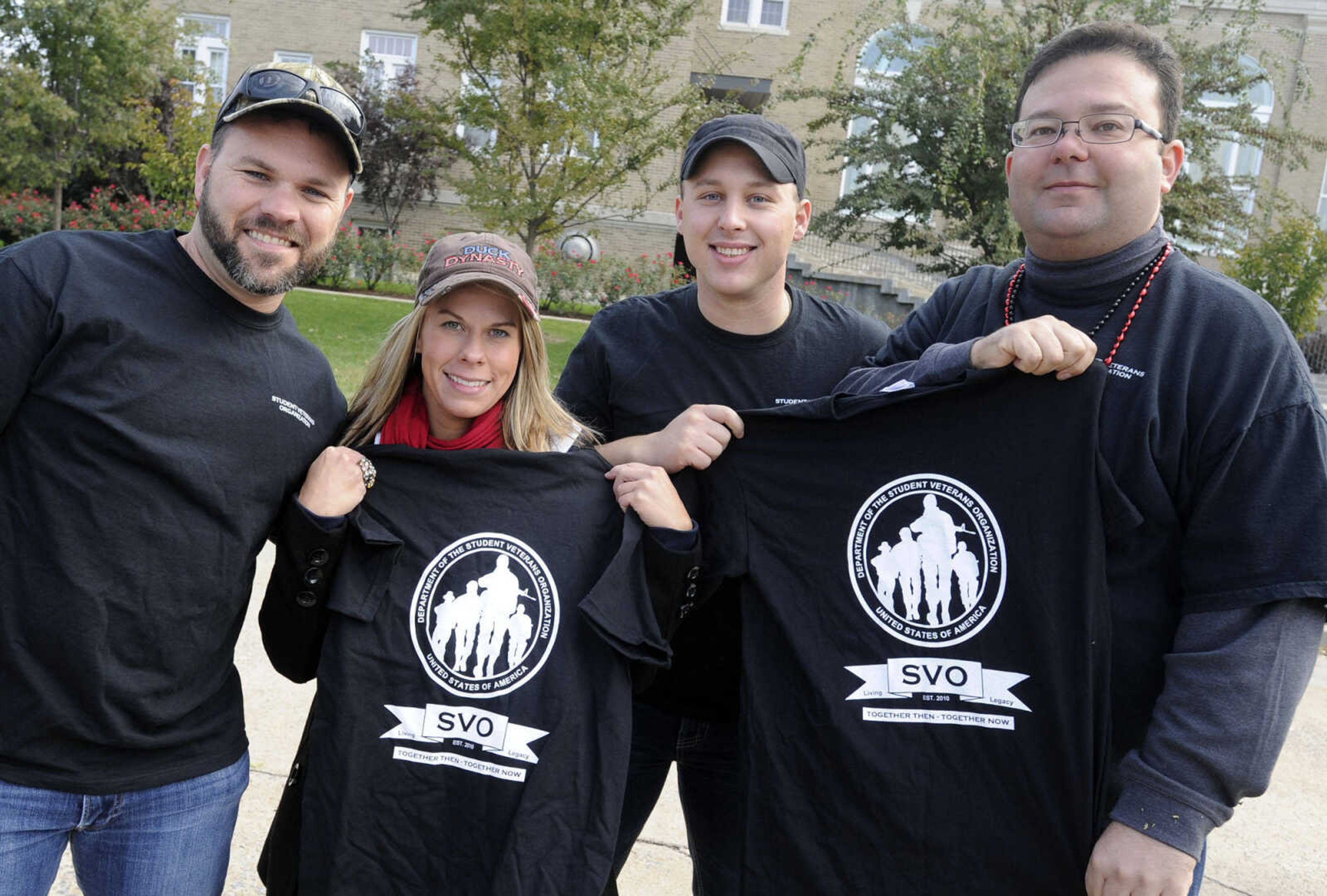 Jared Bush-Howe, left, Kacie Bauman, Bryan Pruett and Charles DiStefano pose at a tailgate before the SEMO Homecoming game Saturday, Oct. 26, 2013 in Cape Girardeau.