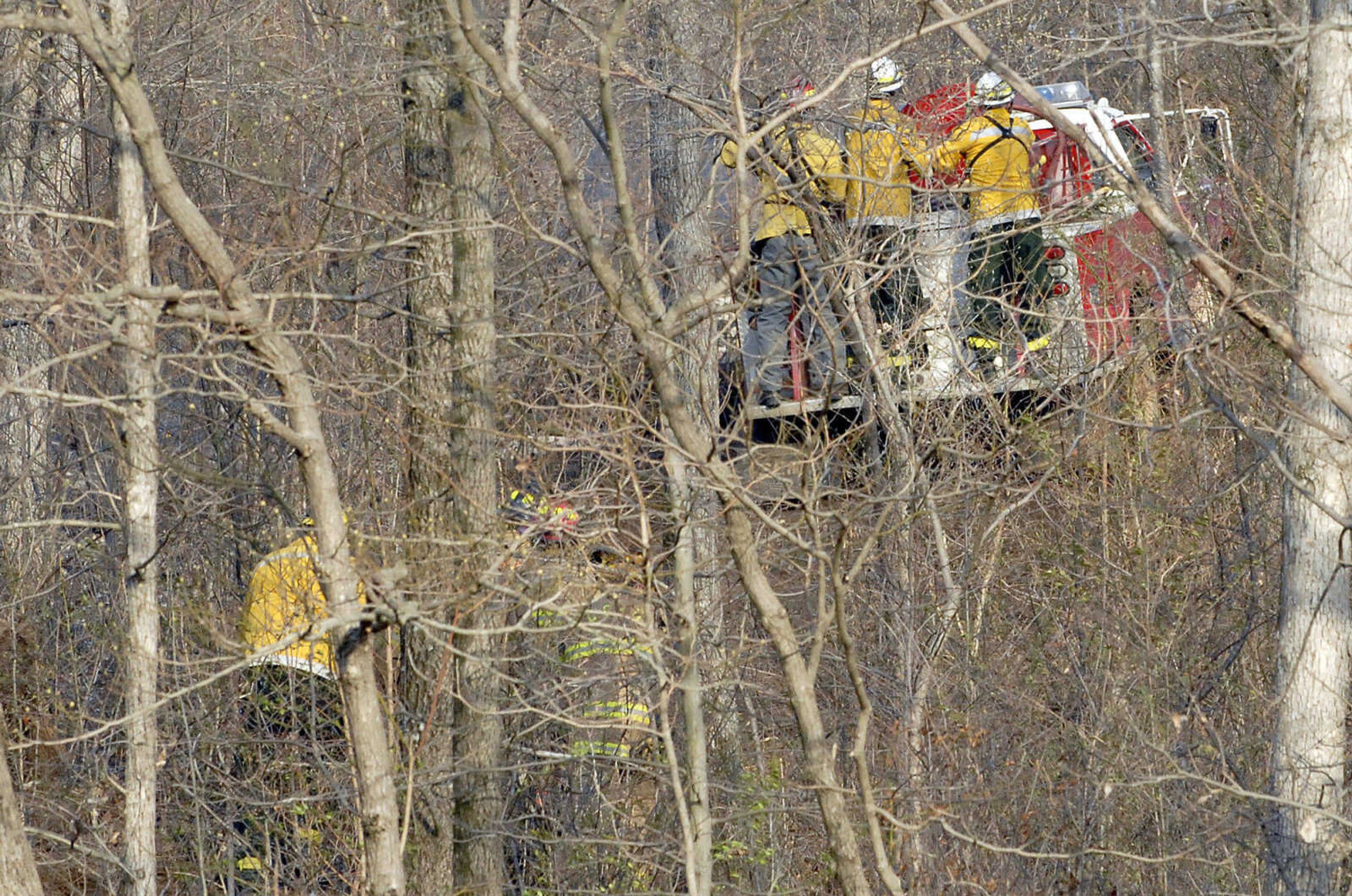 LAURA SIMON~lsimon@semissourian.com
Firefighters head into the woods to battle a natural cover fire off of Cissus Lane near Neelys Landing Sunday, April 3, 2011. Firefighters from Cape Girardeau, Perry, Scott, and Bollinger Counties contained the blaze that ravaged 50 acres of land.