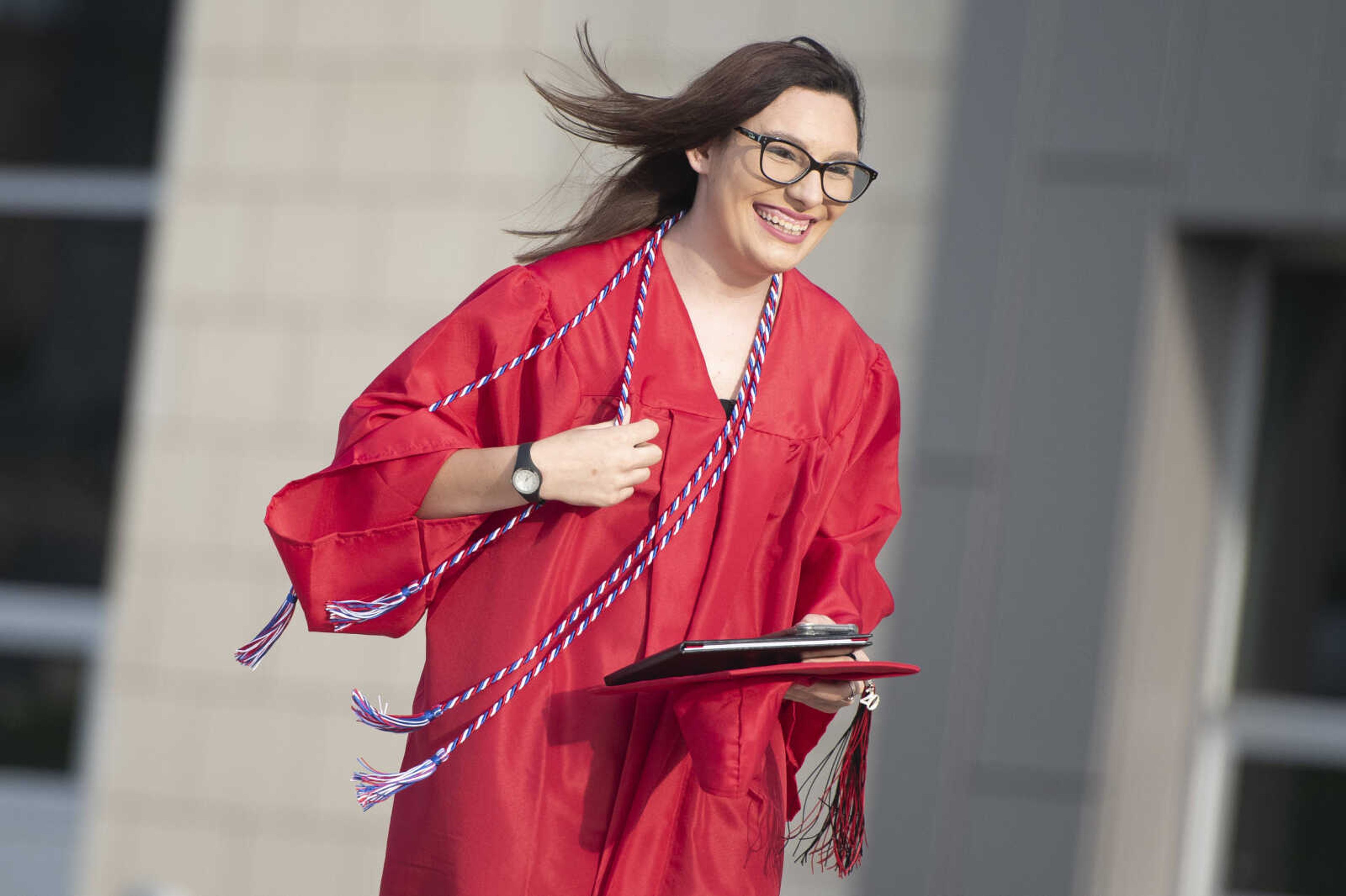 Jackson High School graduate Amber Marie Lowes smiles during a parade to honor military graduates following an in-person military graduation ceremony Friday, May 22, 2020, at Jackson High School.